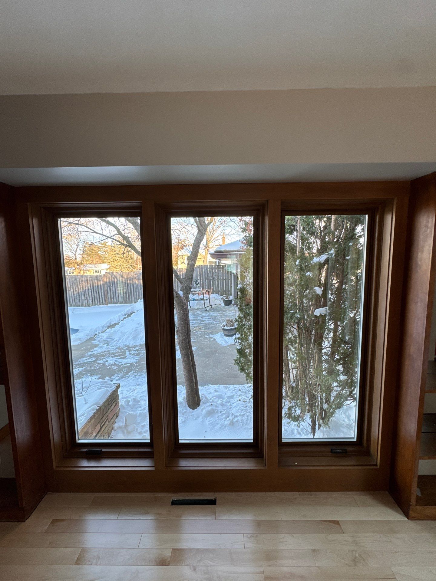 Black-Frame Pella Lifestyle Upgrade on a Partial Brick Home by United Windows and Siding LLC