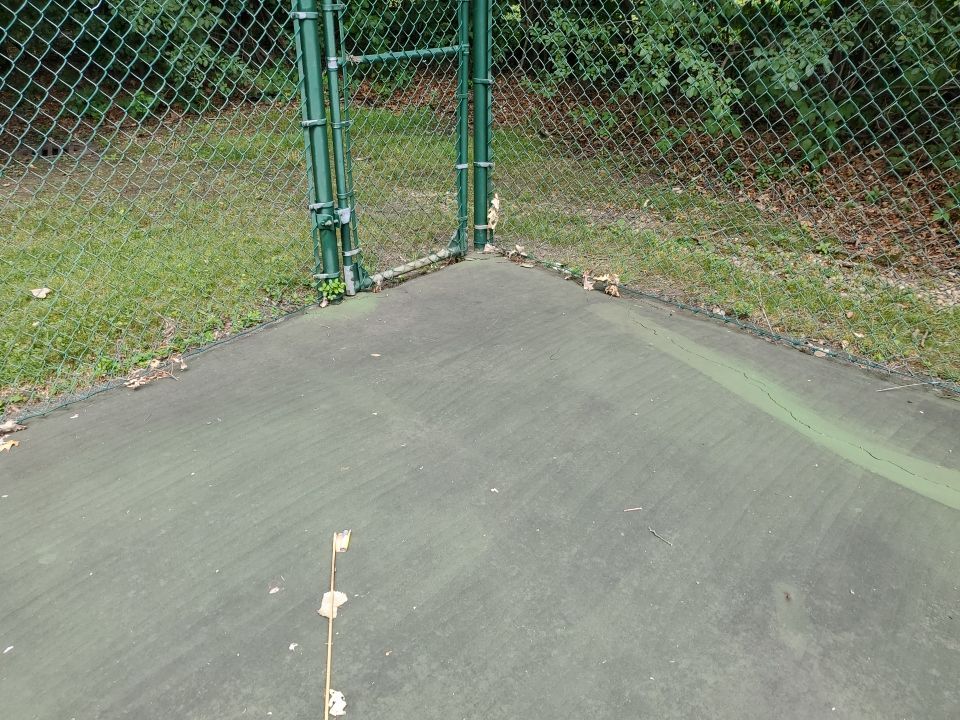 Tennis court cleaning by Northern Power Washing LLC.