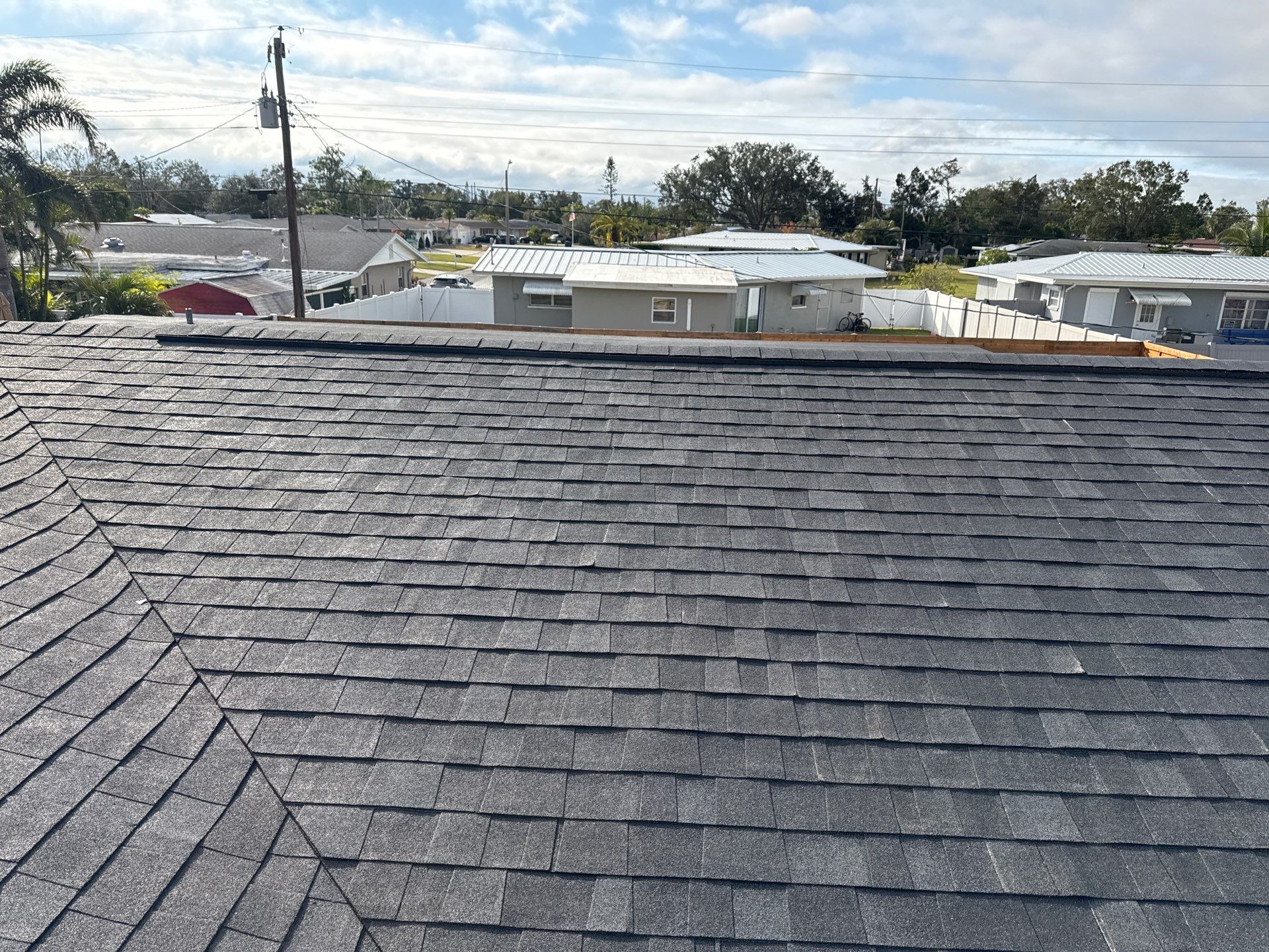 Onyx Black Shingles by Reimagine Roofing