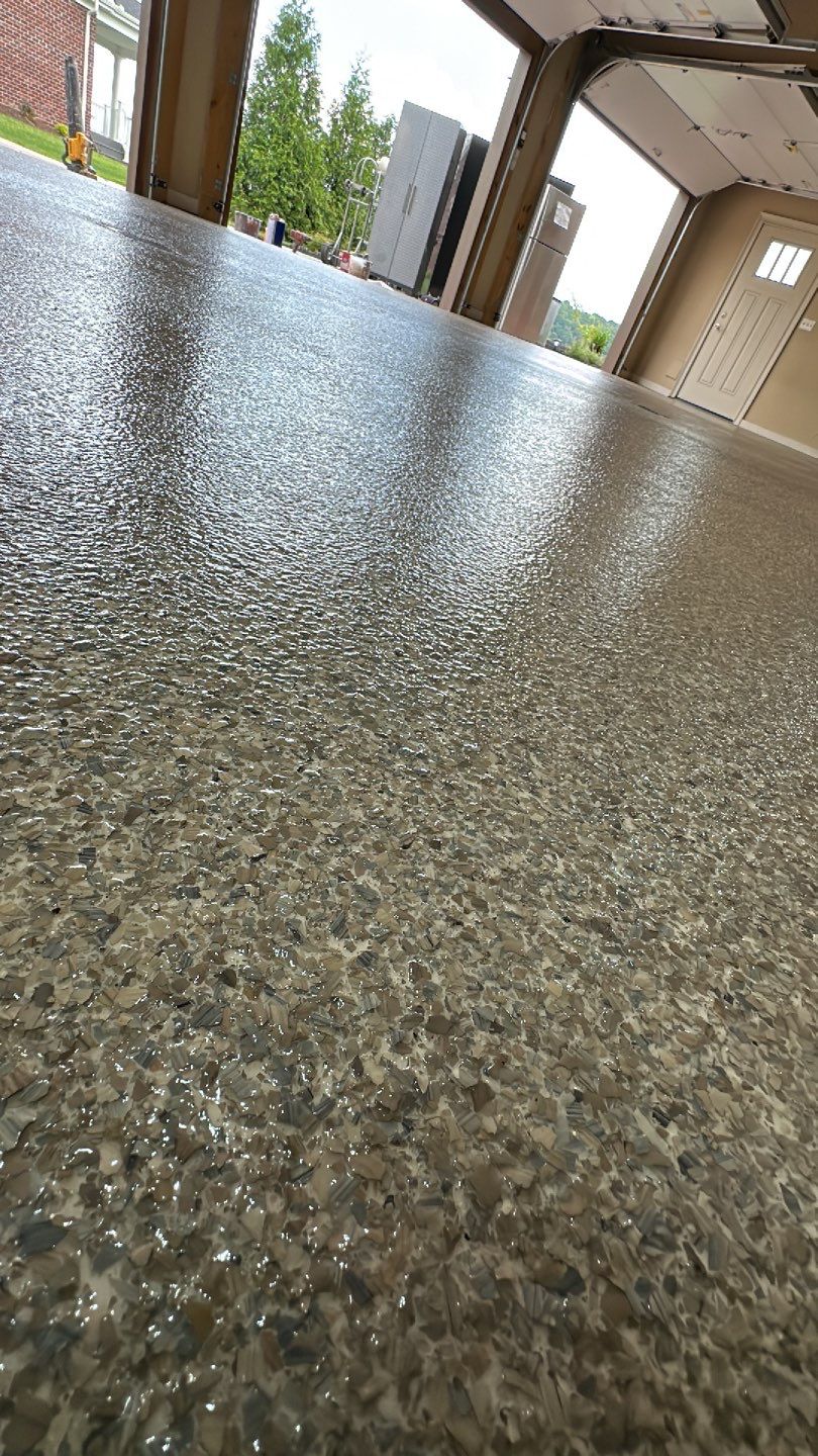 Large Patio + Garage Project in Moon Township by Floors in a Day, Inc