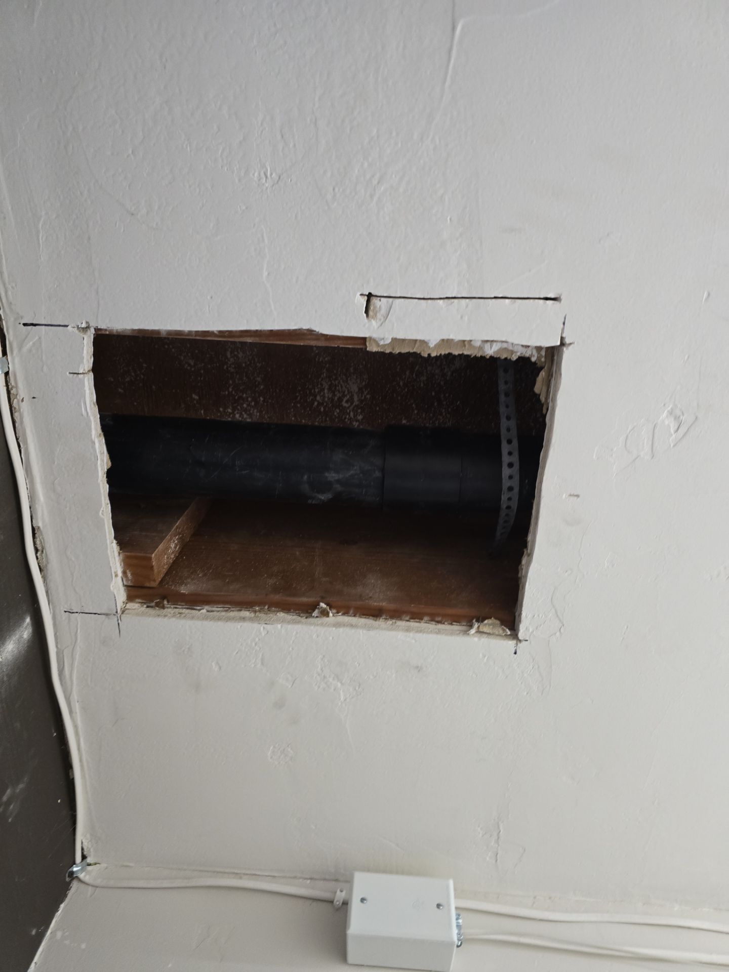 Installation of New Tall Black Piping (Wall to Ceiling) & Underground Piping by Us Plumbing