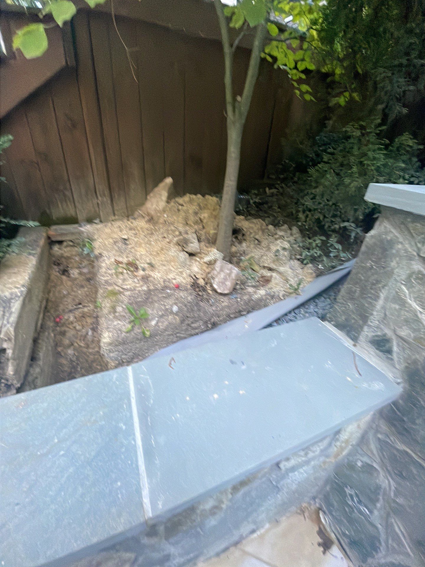 Pool Surround remodel with retaining walls, new waterfall and water slide by Fairfax Contractors, LLC