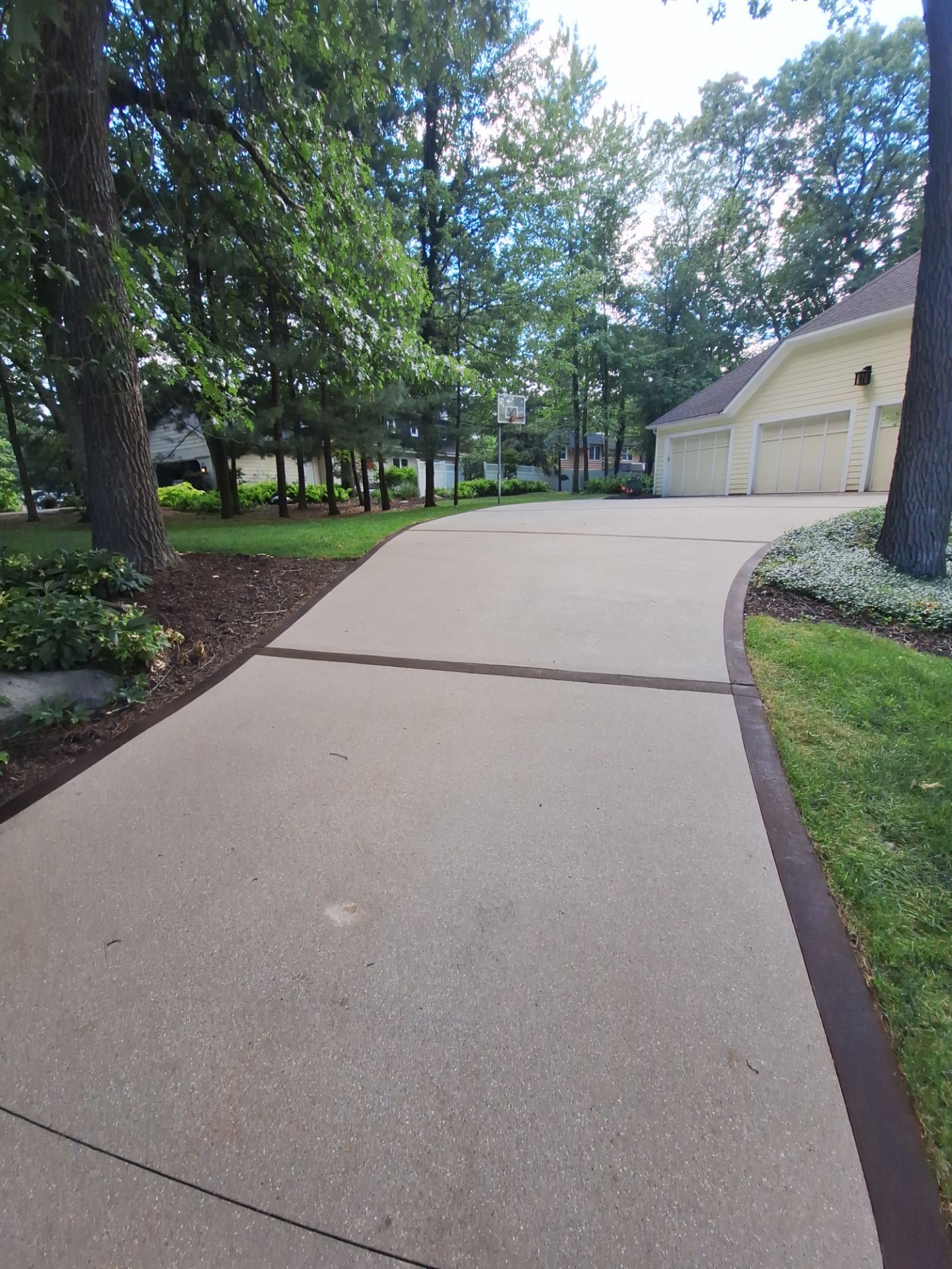 Concrete Driveway and Walkway Staining With Espresso Borders in Grand Rapids by Gordon Painting