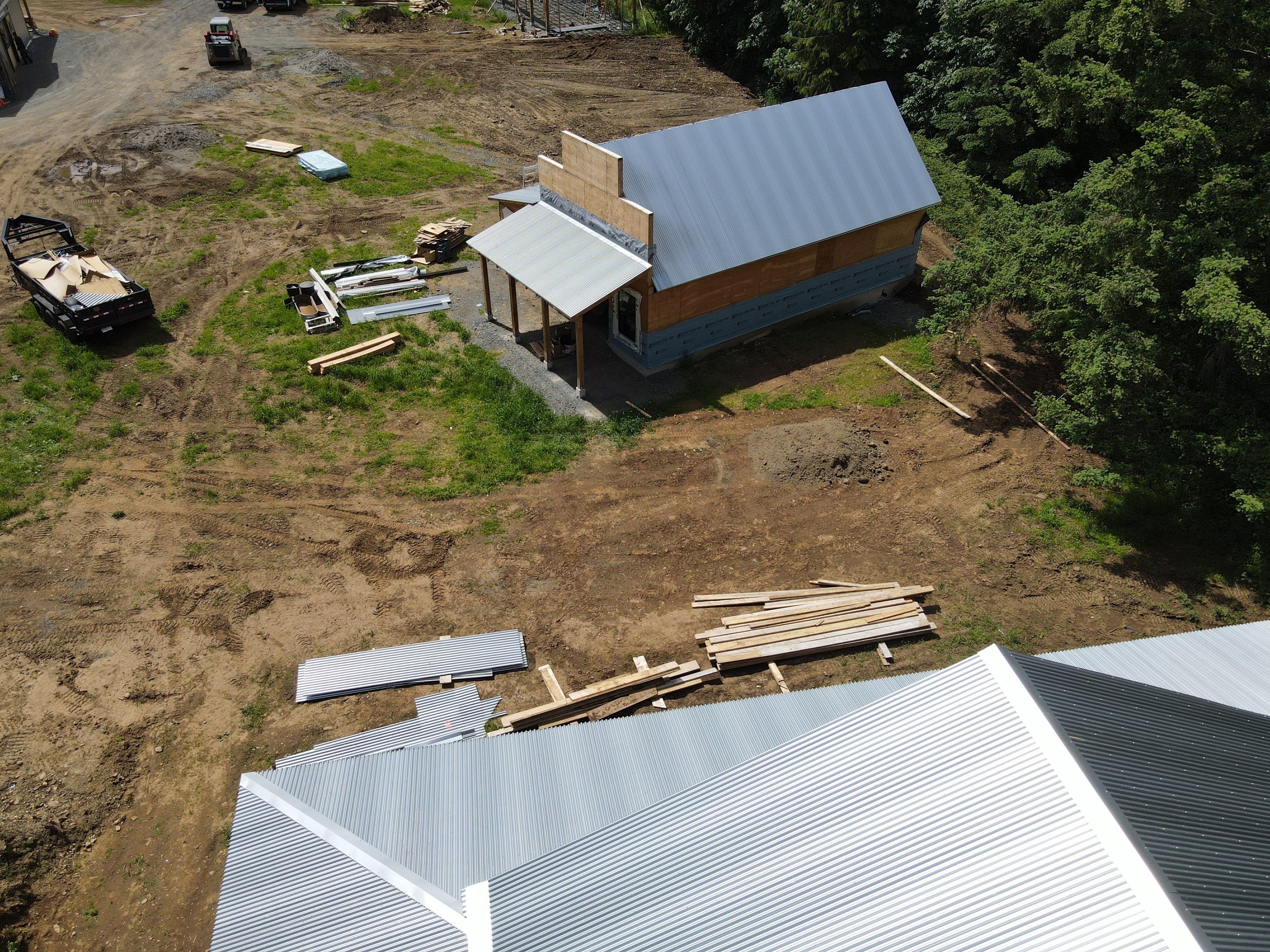 Commercial Roofing Installation using corrugated metal by Top Notch Roofing Inc