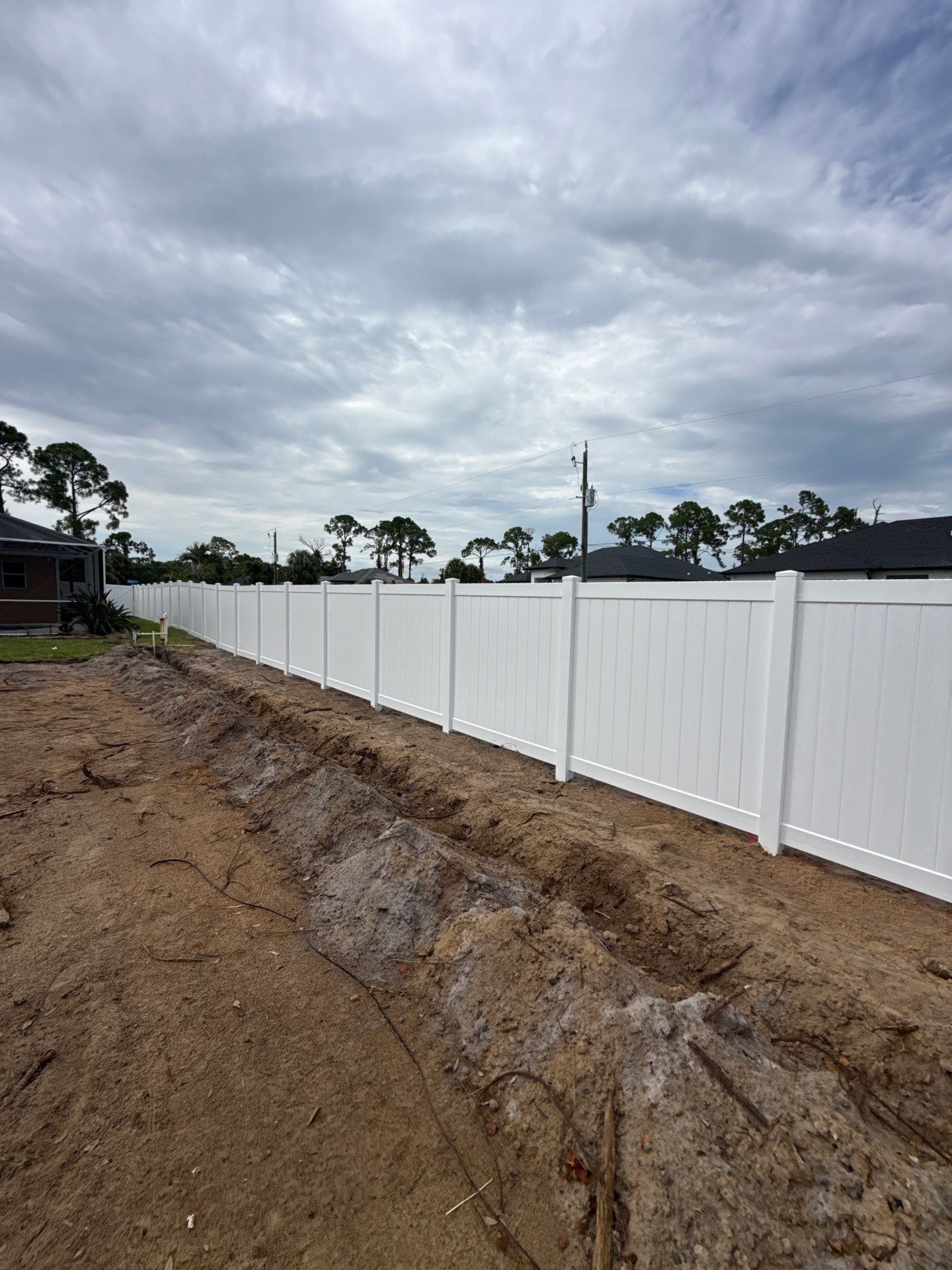 White Vinyl Privacy Fence Installation in North Port Florida by True Fence LLC
