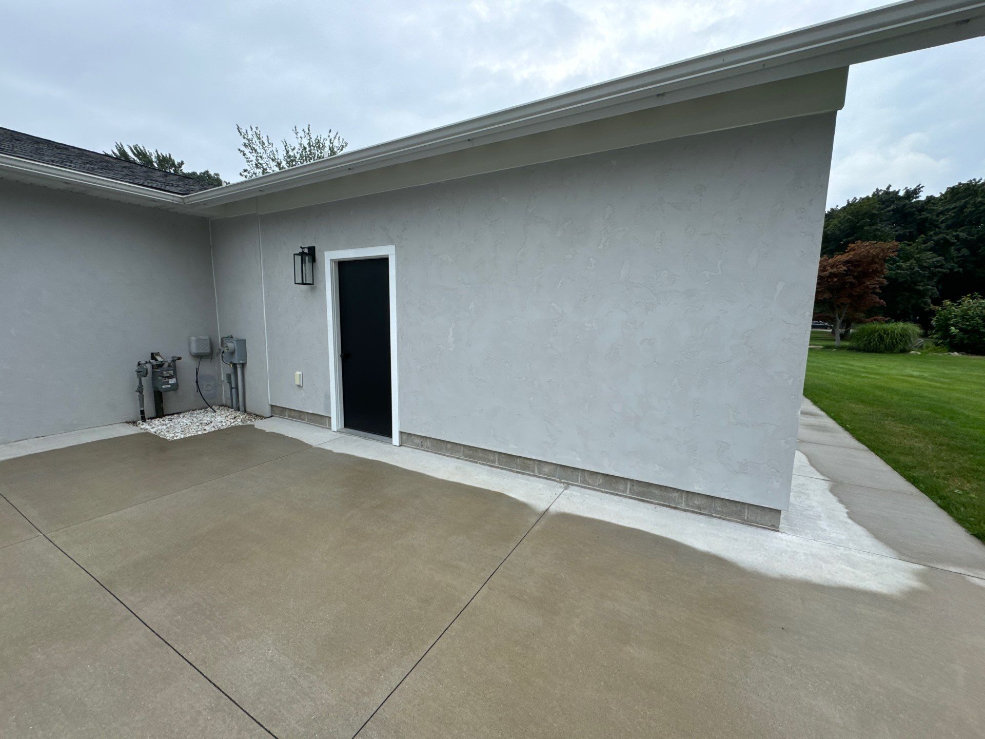 Norton Shores Residential Stucco Repair and Exterior Painting Refresh by Gordon Painting