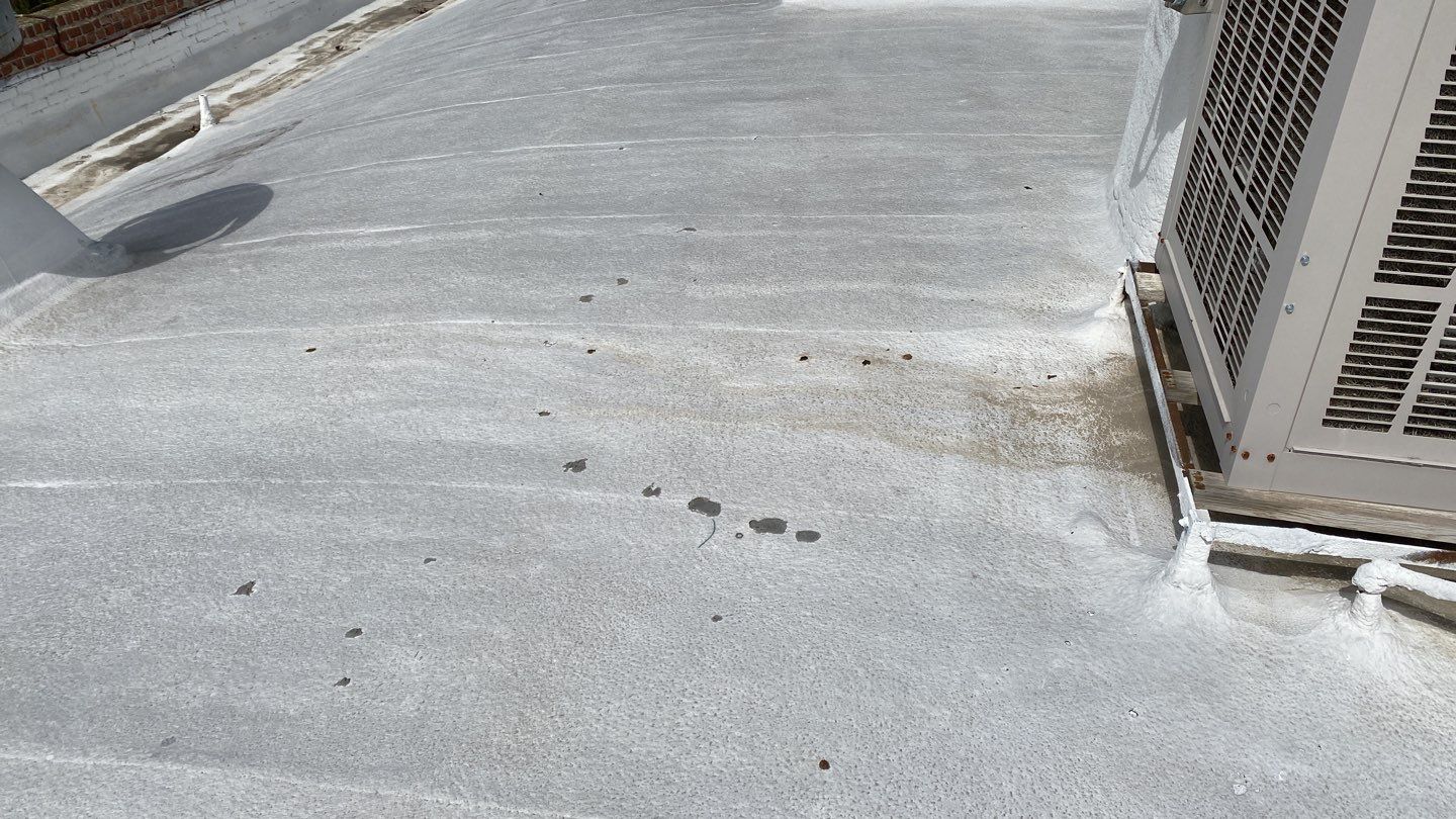 Polyurethane foam roof refurbish and recoating by Straight Edge Roofing Inc