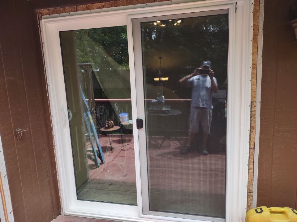 Siding Installation using Heartland Patio Door by EEC  Windows, Siding & Roofing 