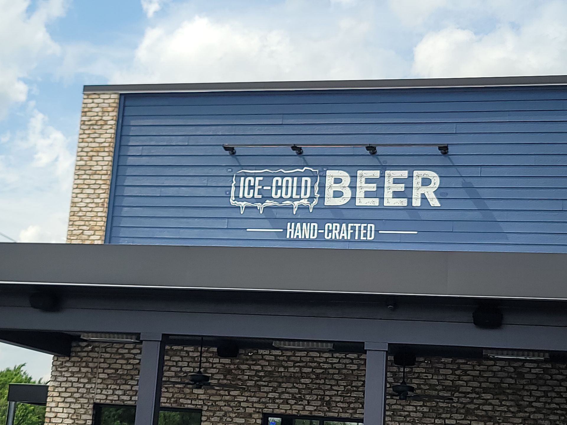 Bubba's 33 Exterior Vinyl Graphic and Painted Signage Installation by Hayes Design co