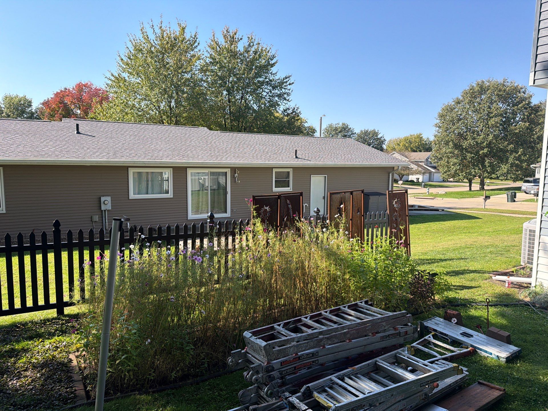 Black Vinyl Spaced Picket Fence Installation in Cedar Falls by Perfect Picket Fence and Stain