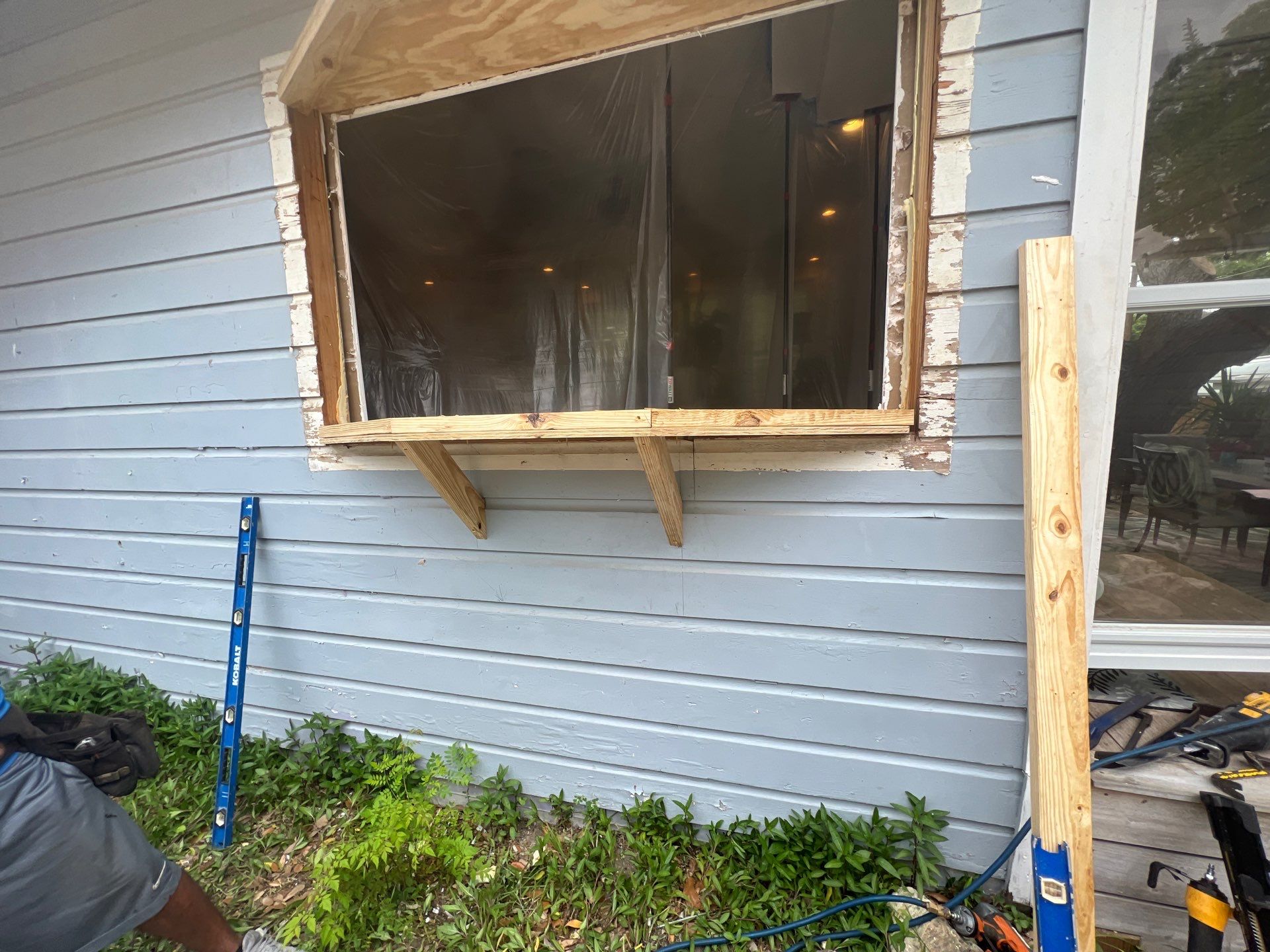 Installing Windows on a Submarine  by Bayfront Roofing and Construction