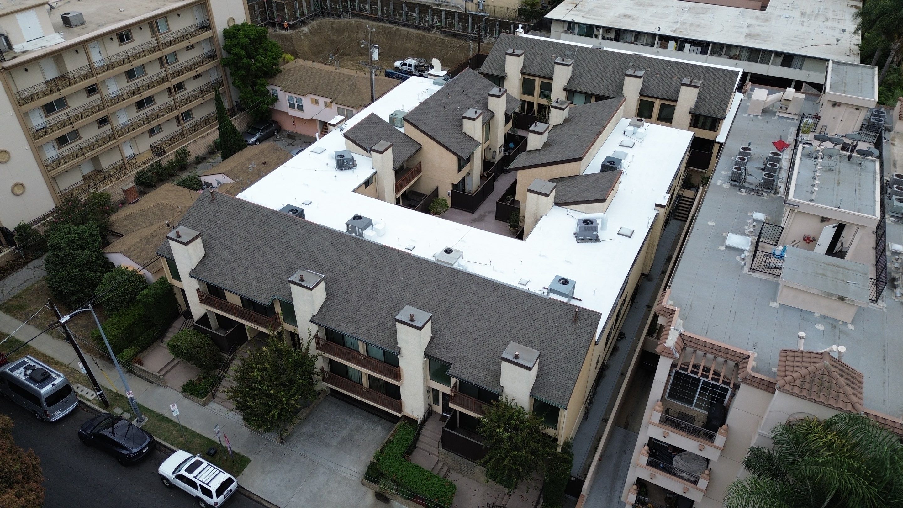 Apartment Building Silicone Coating by Hull Brothers Roofing