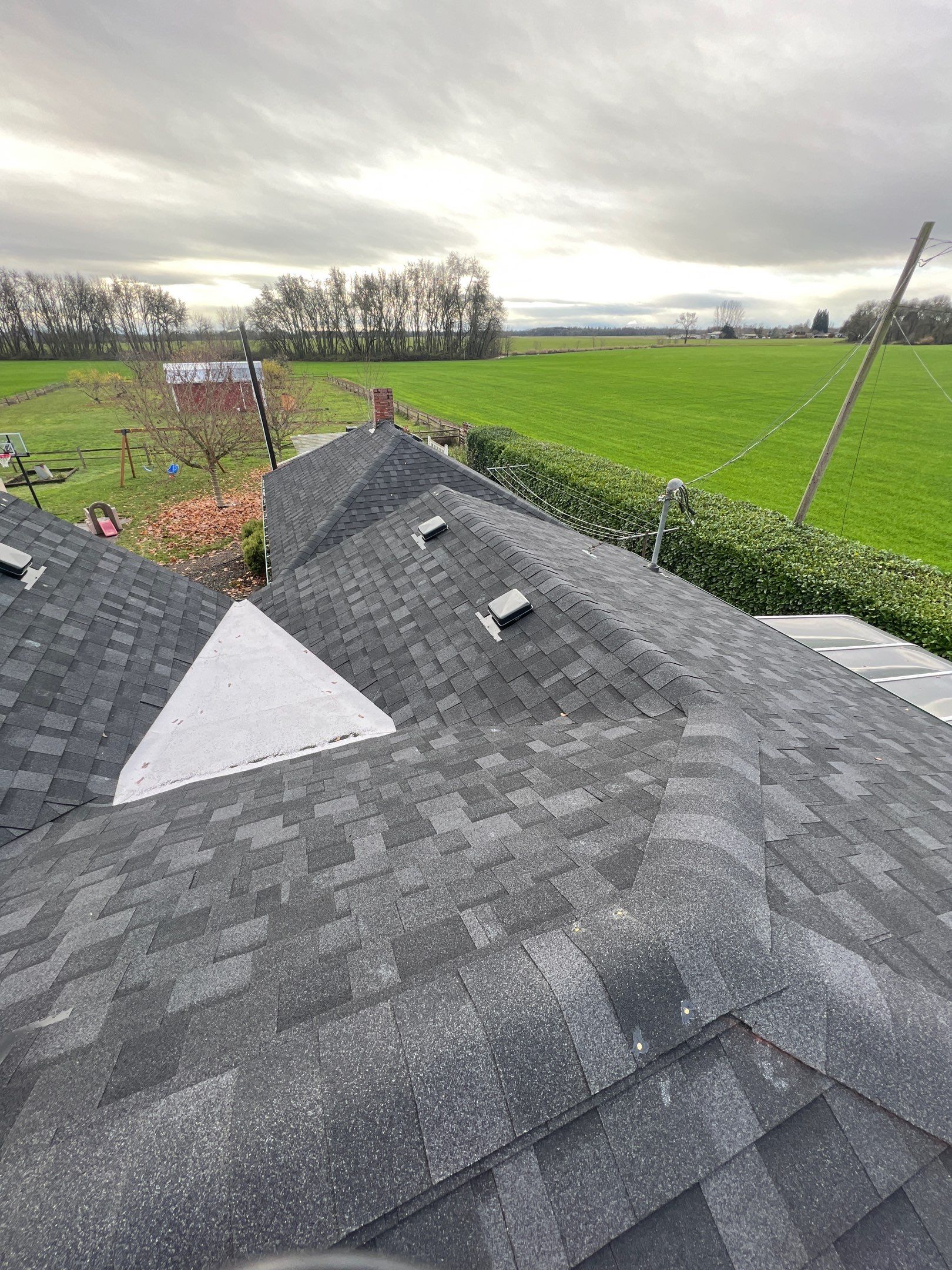 Residential Roofing Installation using IKO Dynasty (Color: Granite Black) by Orezona Building & Roofing Company, Inc.