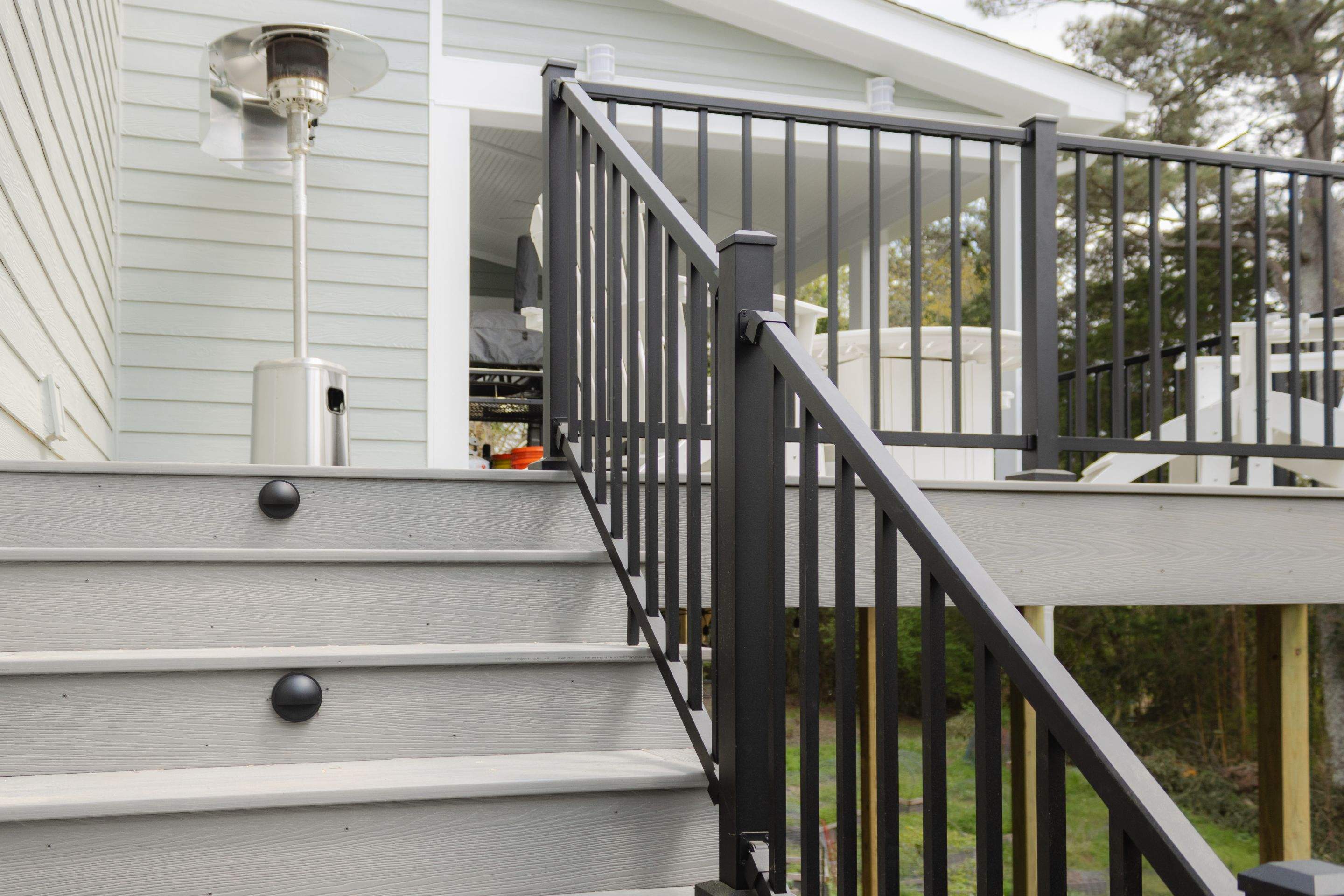 Covered Porch and Deck Build using Deckorators Venture Series Decking and Trex Select Aluminum Railing by Nelson Exteriors