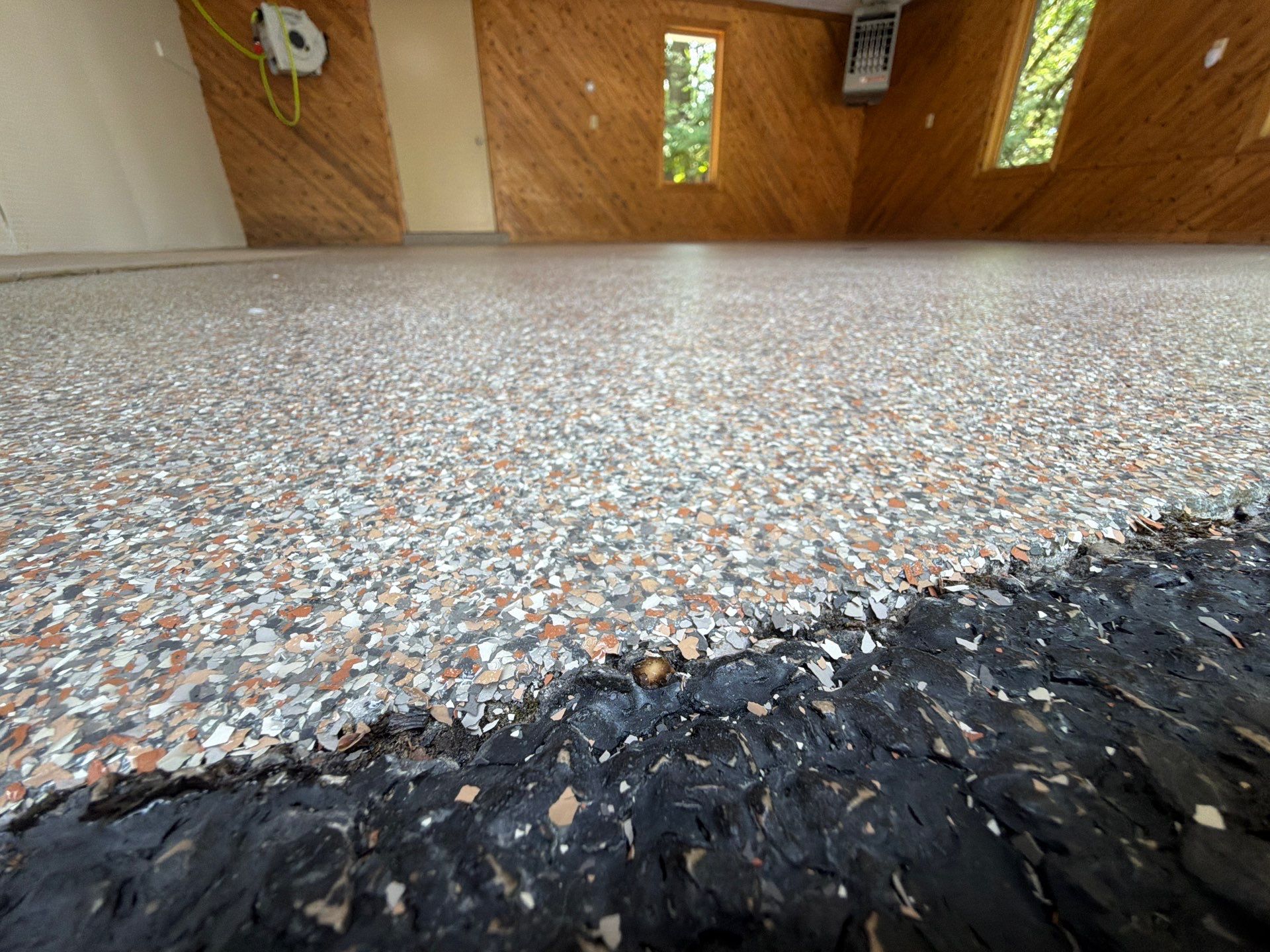 Grand Haven Garage Epoxy Floor Coating with Wax Wing Flake by Gordon Painting