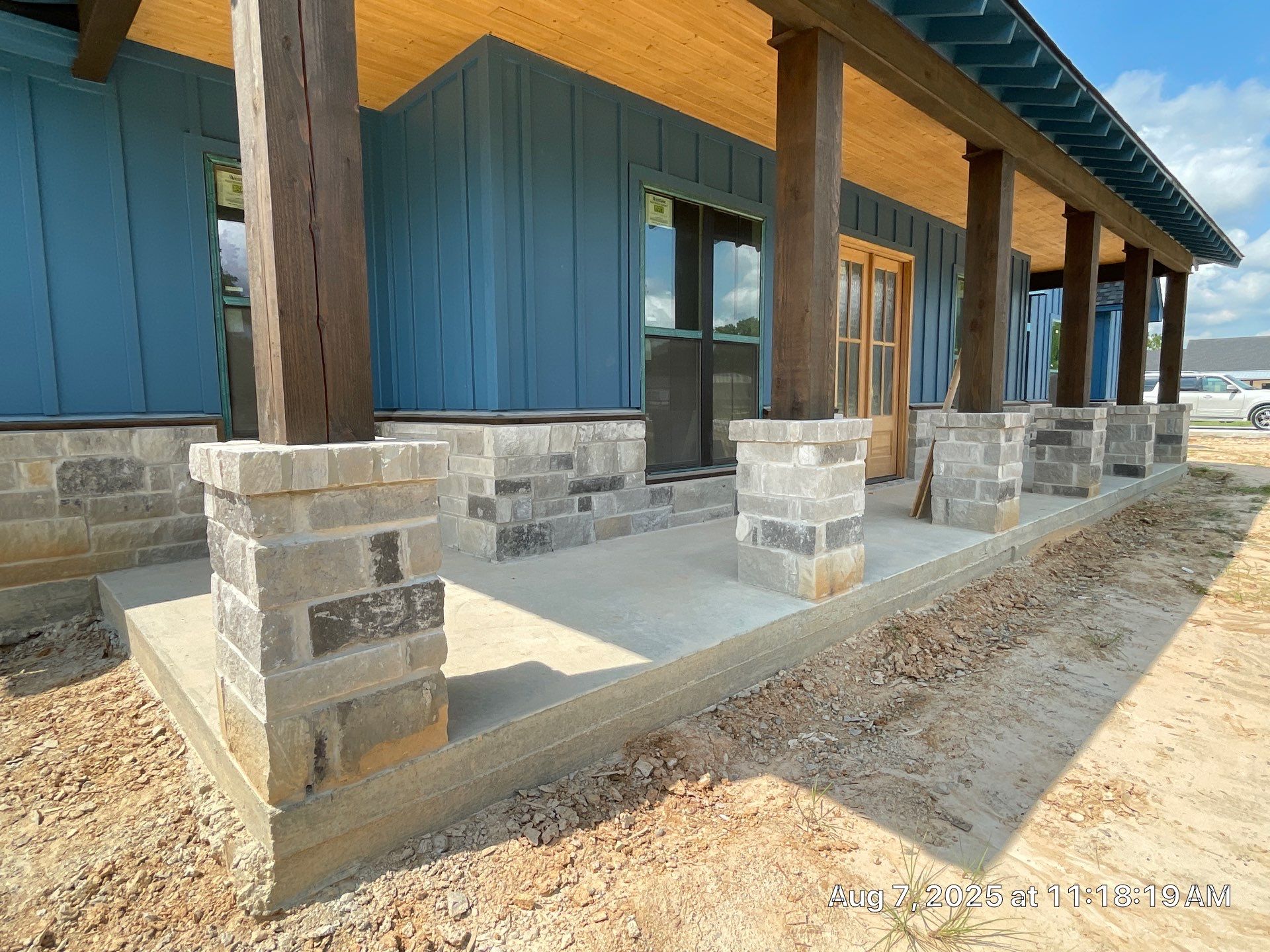 Natural Stone Elegance: Apex Installation Accented by Blue Siding by Apex Conventional Stucco Llc