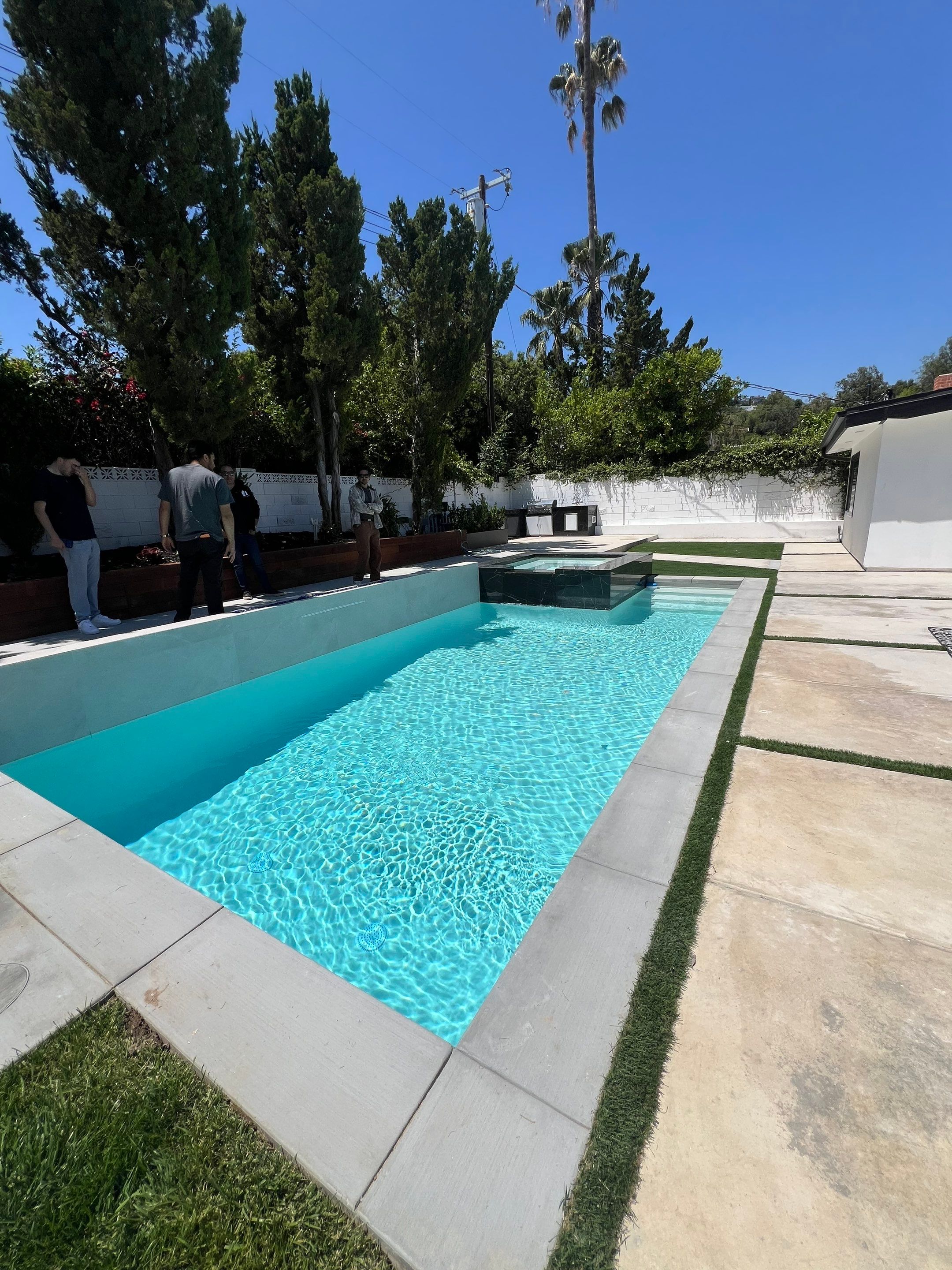 Pool With Raised Spa, Water/Fire Feature by Lax Home Inc 