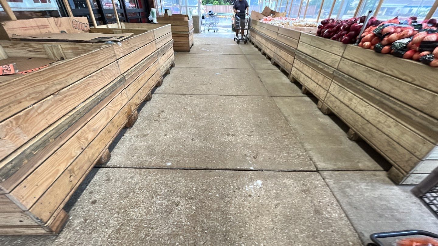 Concrete sidewalk cleaning and degreasing by Northern Power Washing LLC.