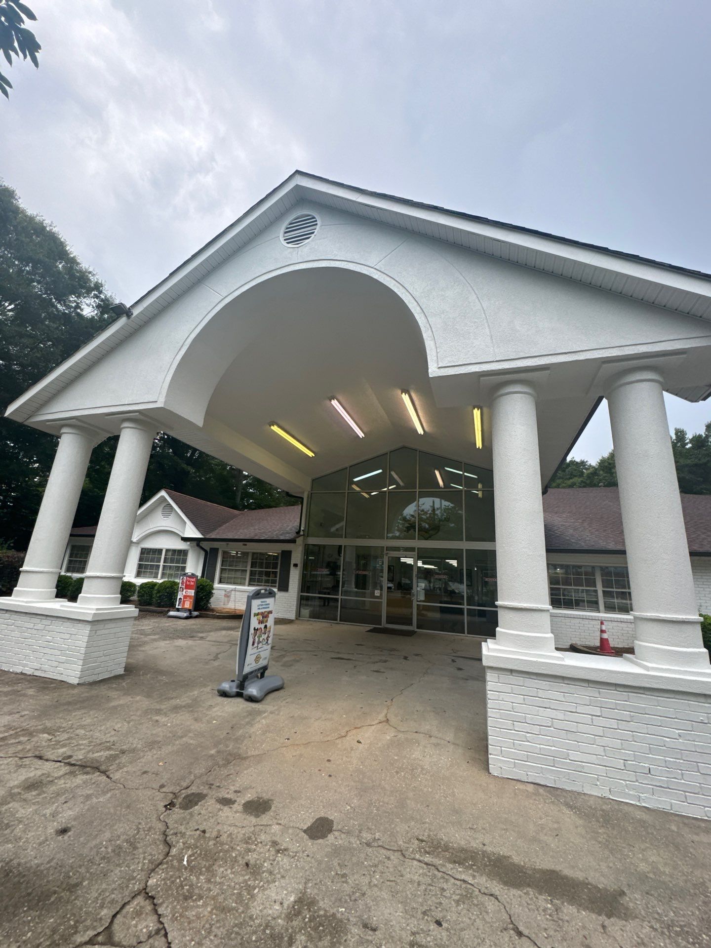 Commercial Exterior Brick and Stucco Painting in Fayetteville by Swift Home Renovations