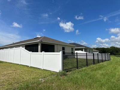 Vinyl Fence Installation using White Vinyl Privacy and 3 Rail Aluminum Fence 
