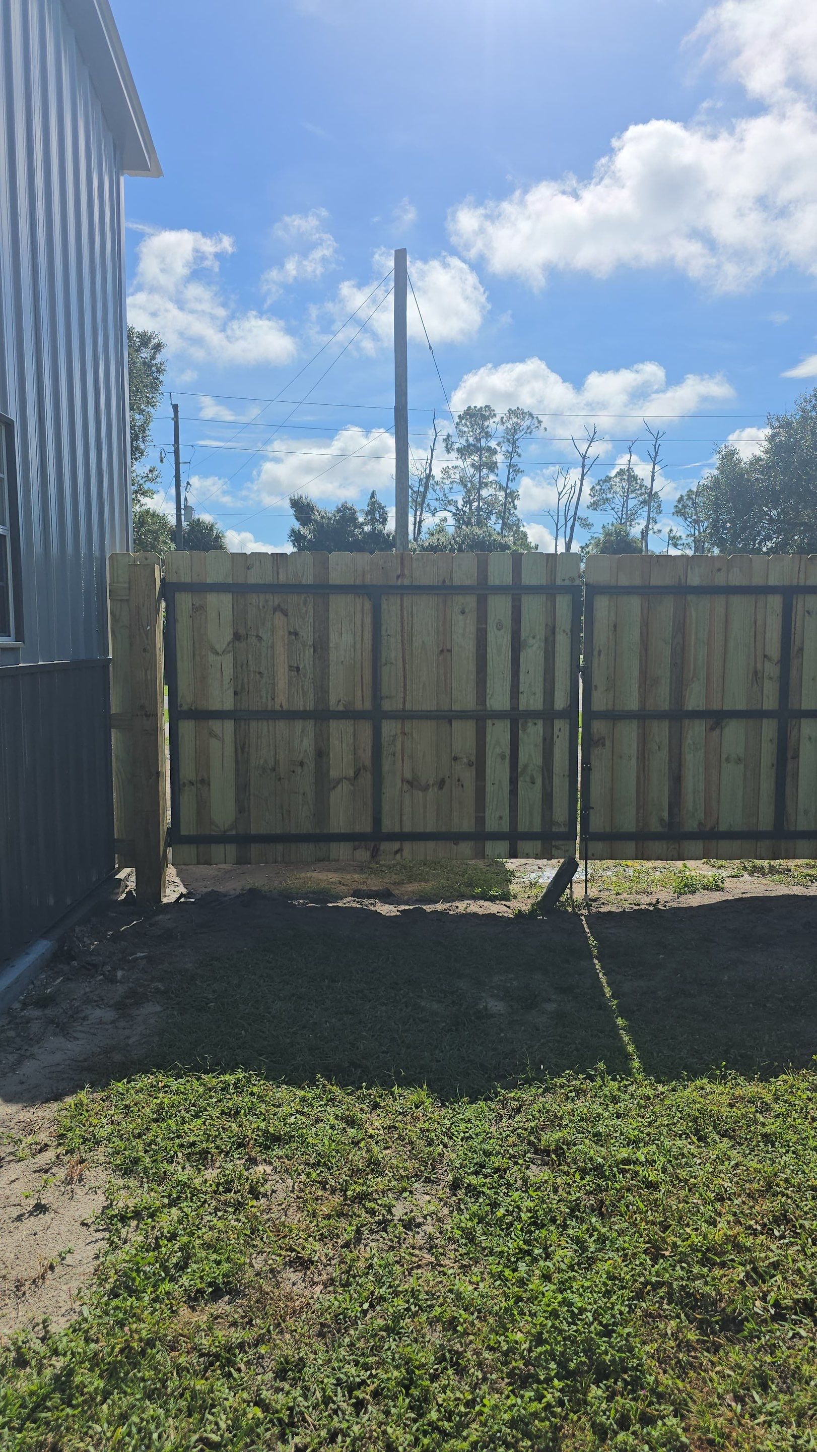 Pressure-Treated Wood Privacy Fence and Gate Installation in North Port by True Fence LLC