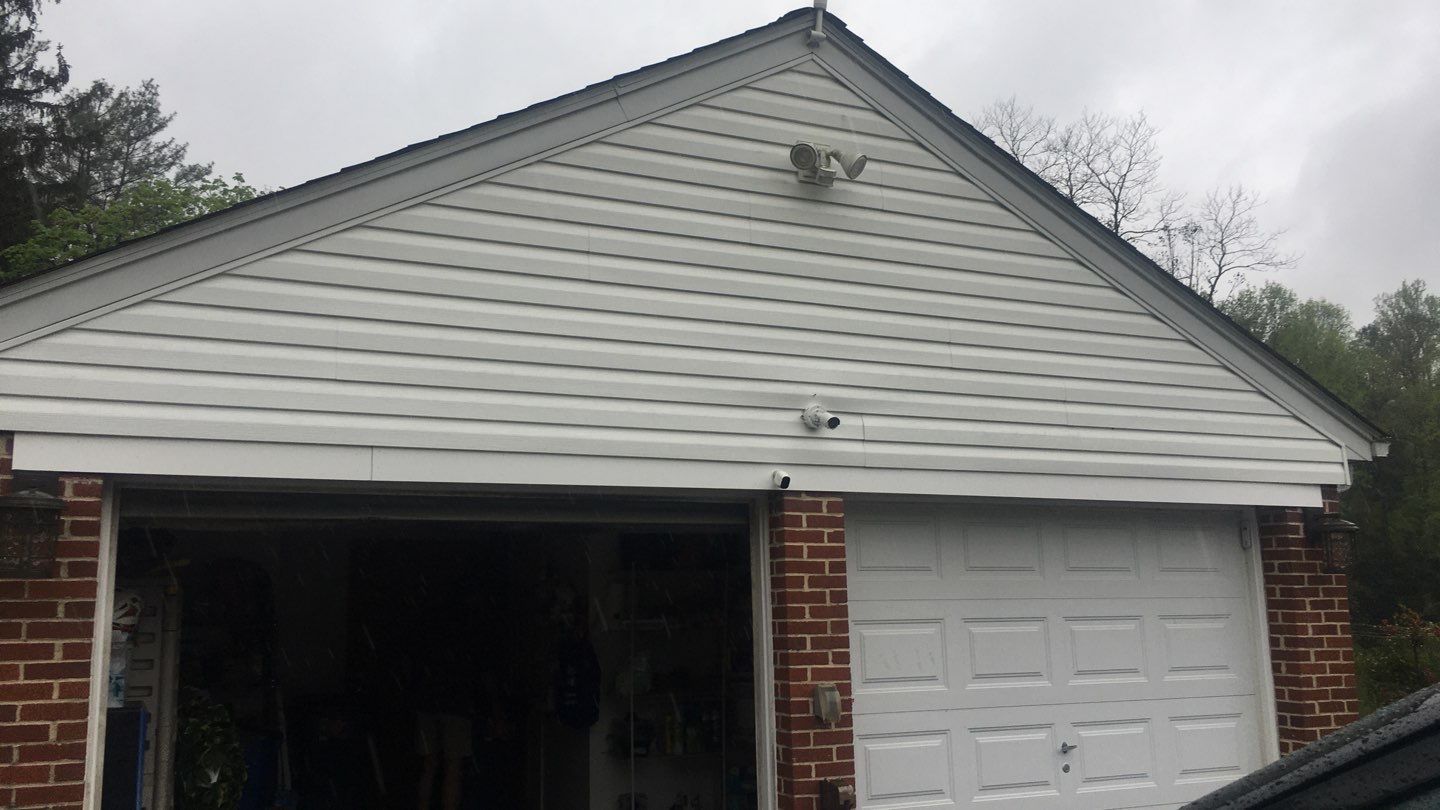 Gutter and Siding Replacement by American Home Contractors