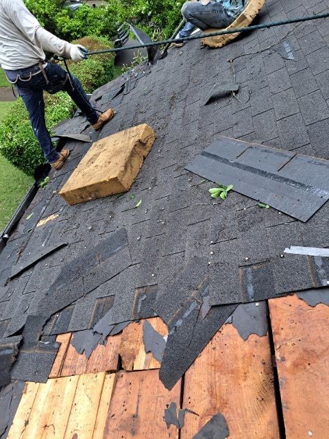 roof replacement and new black gutters by Nailed It Roofing & Remodeling LLC