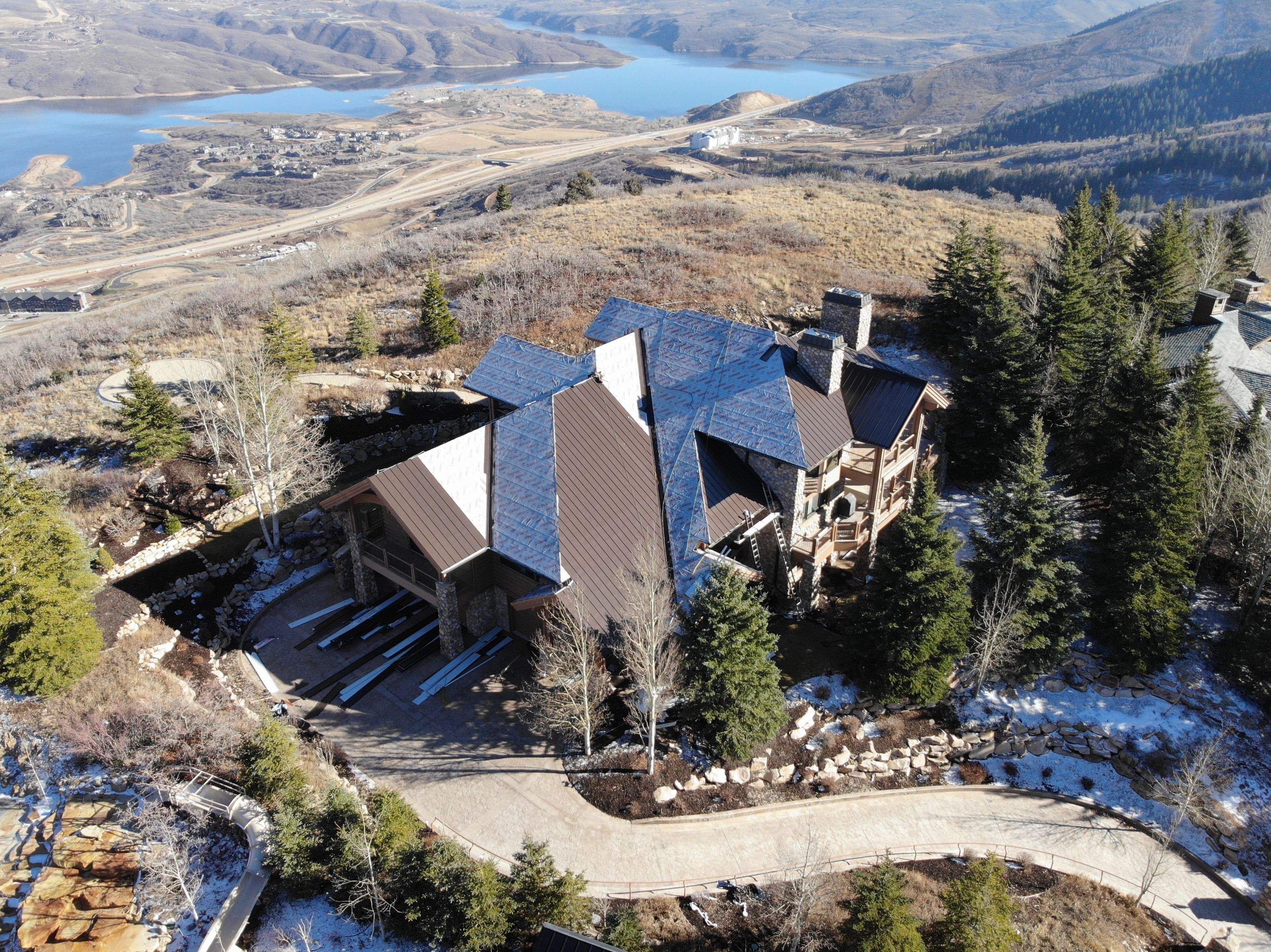 Standing Seam Metal Roof Replacement After Snow Damage by ASAP Roofing & Restoration