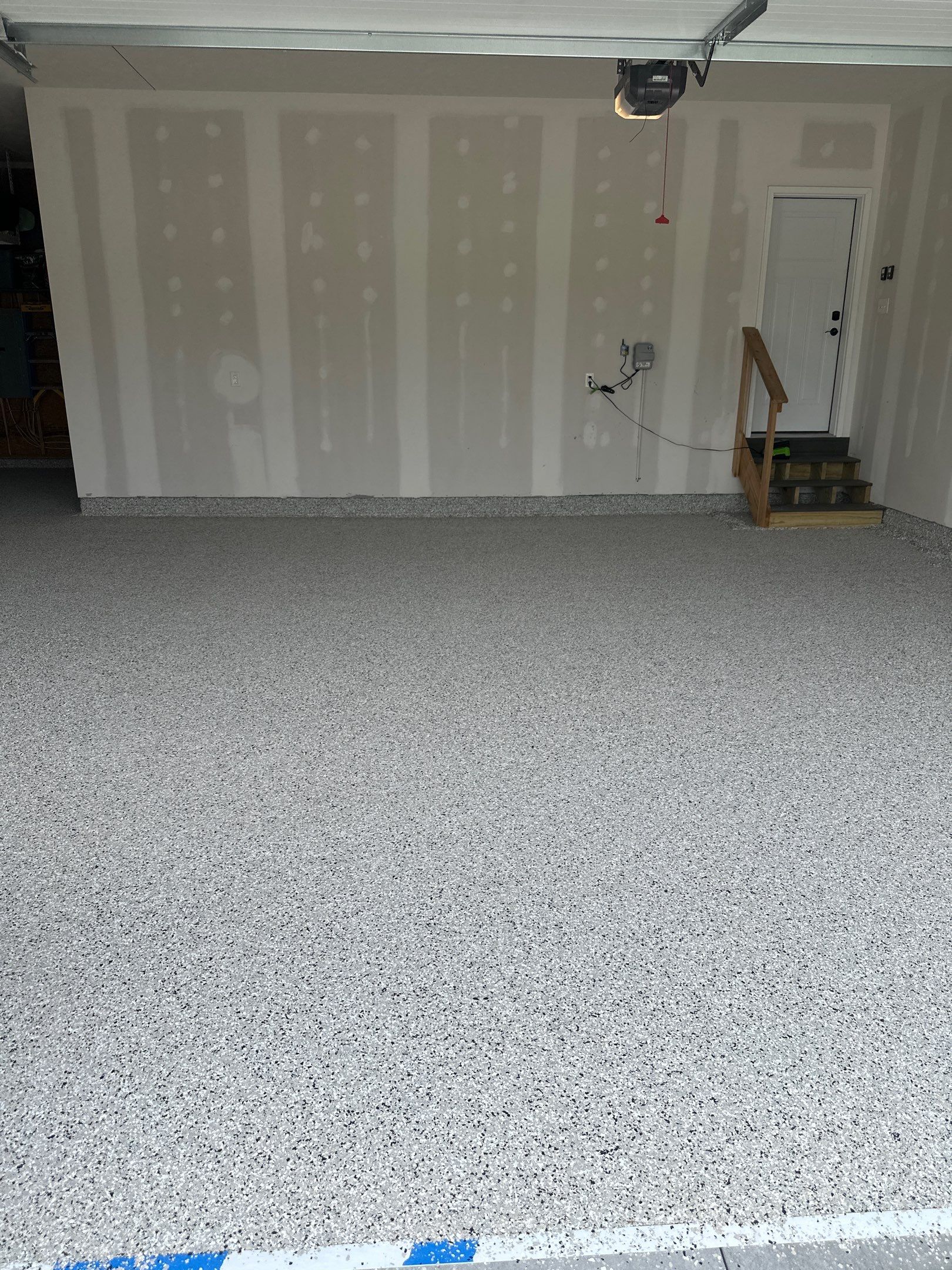Three-Stall Garage Epoxy Floor Coating Installation in Lincoln by Goat Coatings
