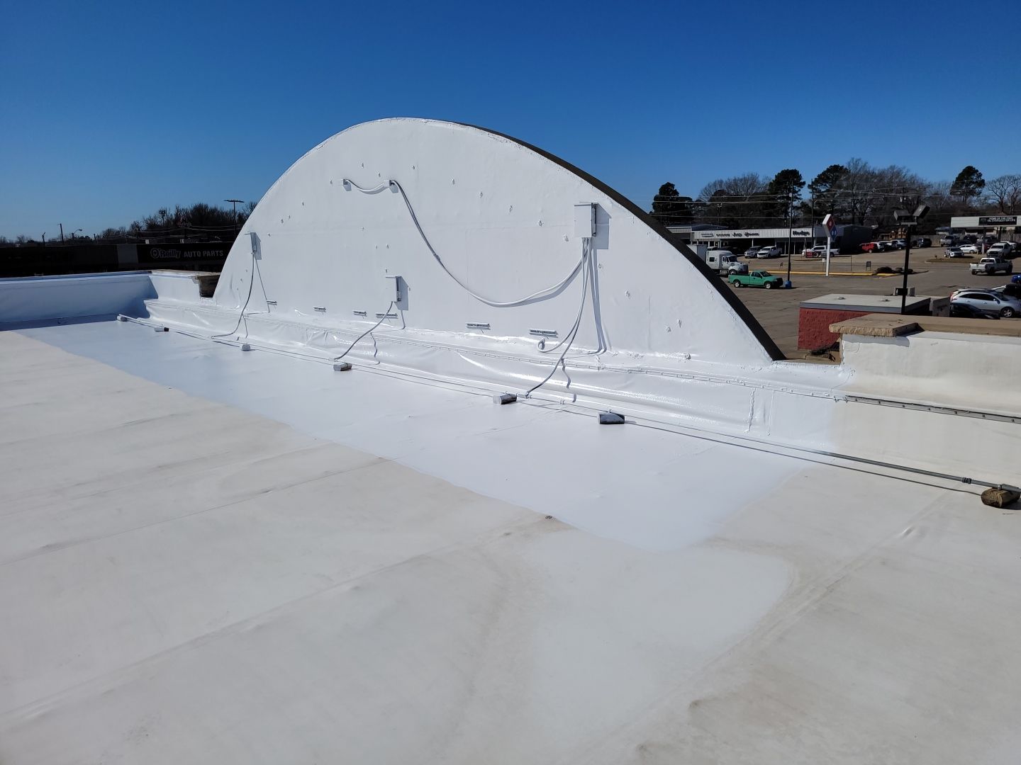 Commercial Roofing Installation using Aldocoat Coatings by Hostetler Roofing