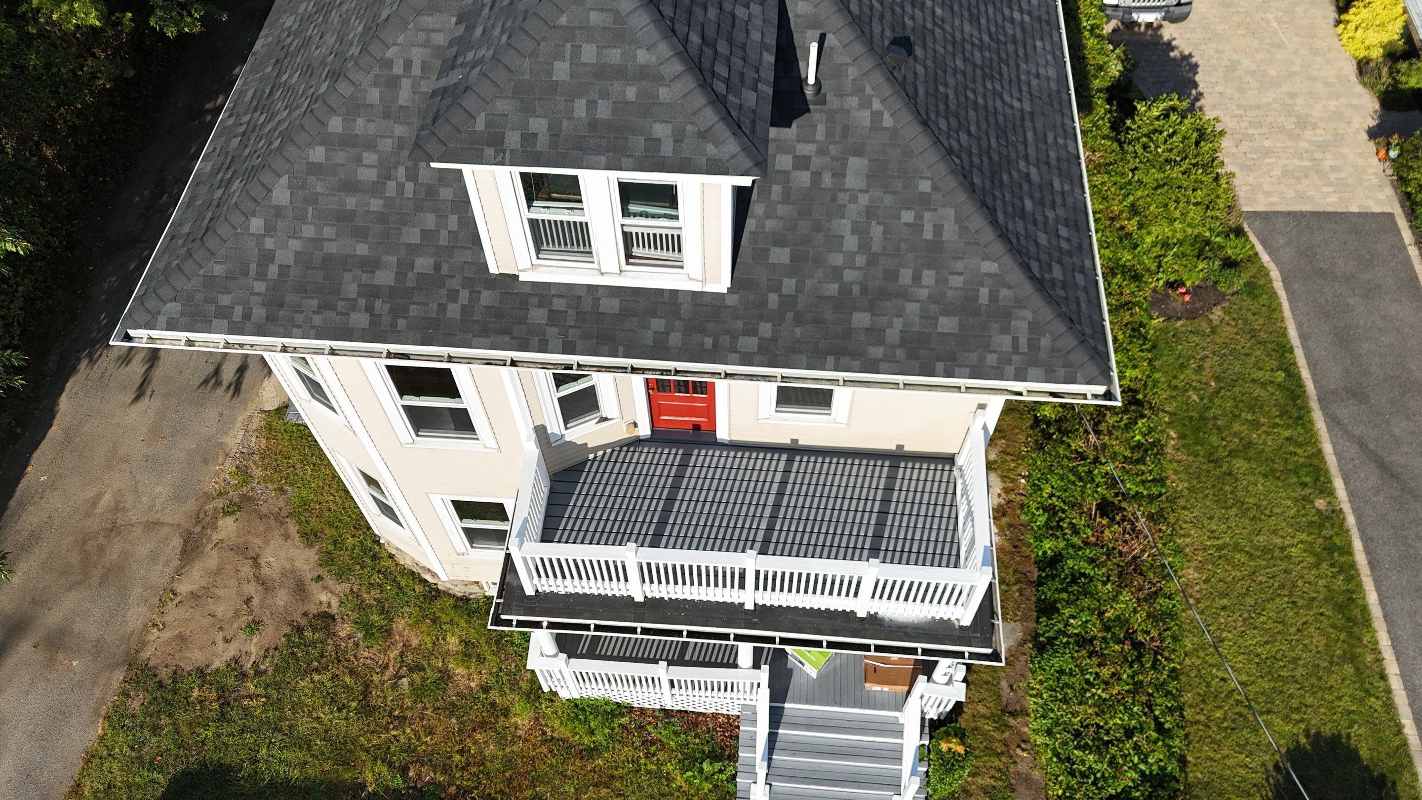 Roof Replacement with Skylight Flashing in Waltham, MA by Mighty Dog Roofing of Greater Middlesex County