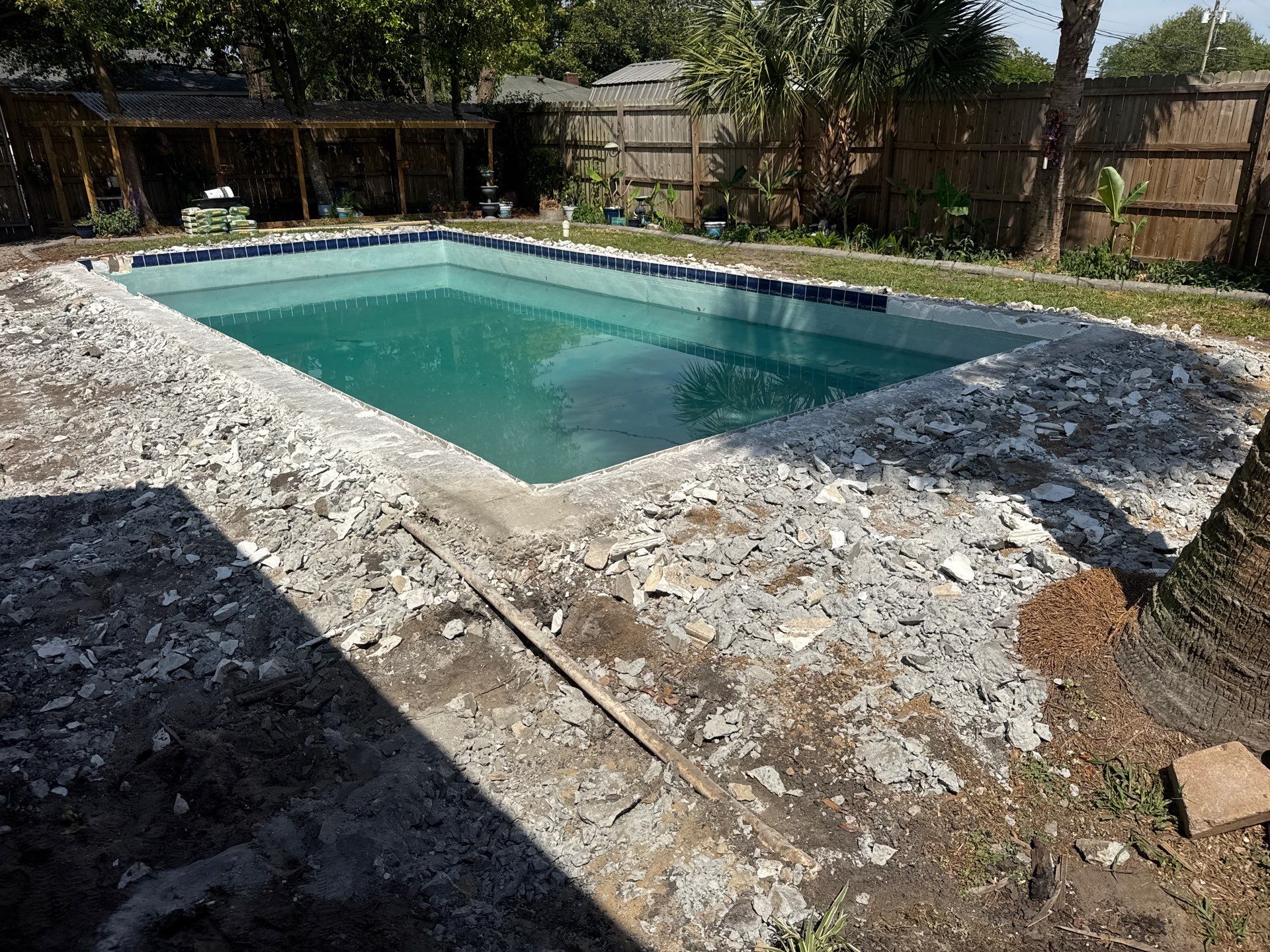 Savannah Pool Deck Replacement with Textured Concrete and Brick Coping by Lowcountry Scapes, LLC