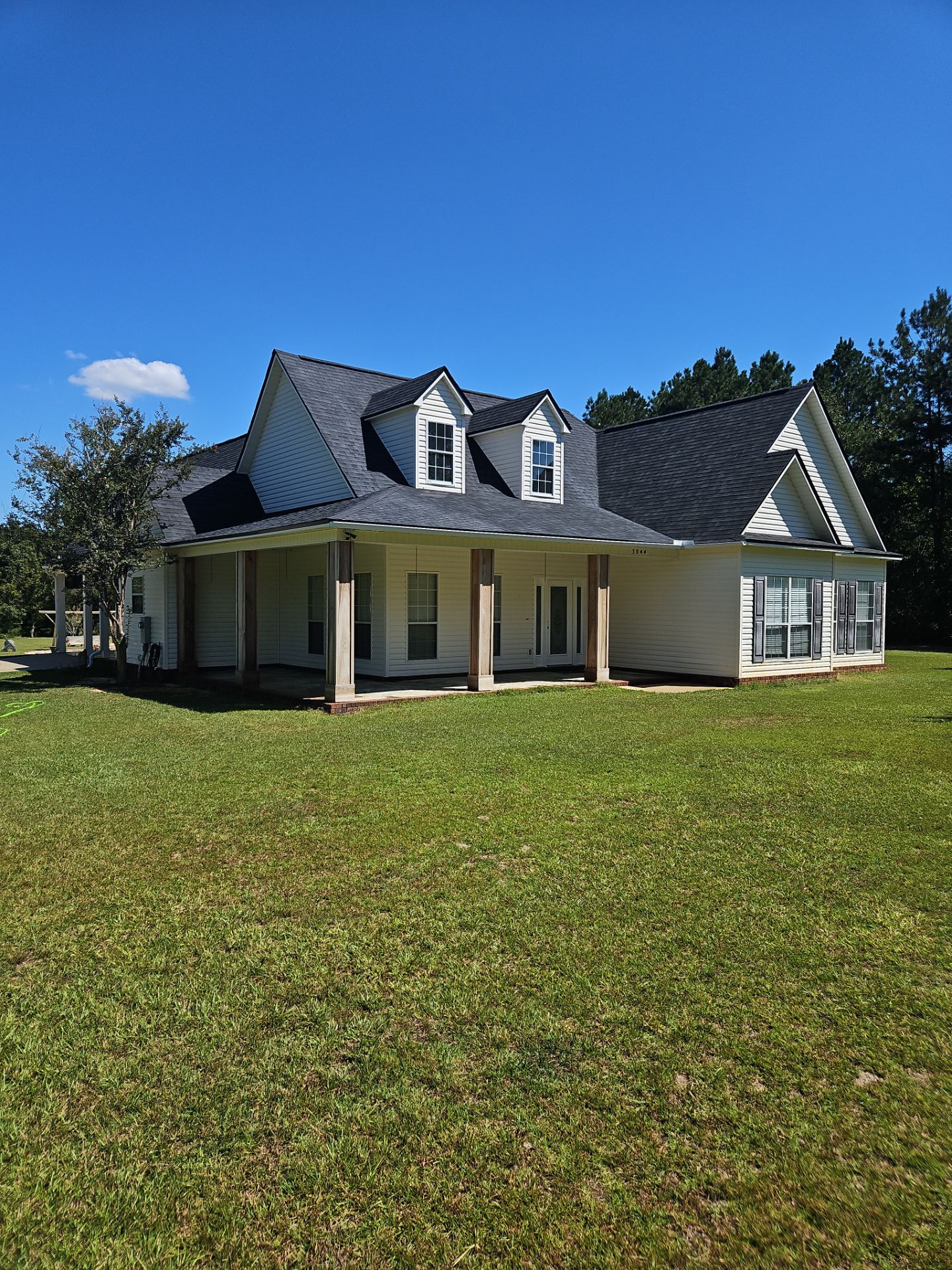 House siding and roof surfaces after cleaning in Milton, FL 32570