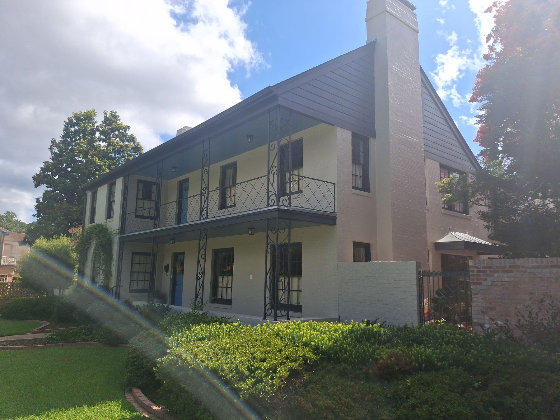 Exterior Painting in Tyler, TX | White Brick Home with Sherwin-Williams Duration by Quality Coats Painting