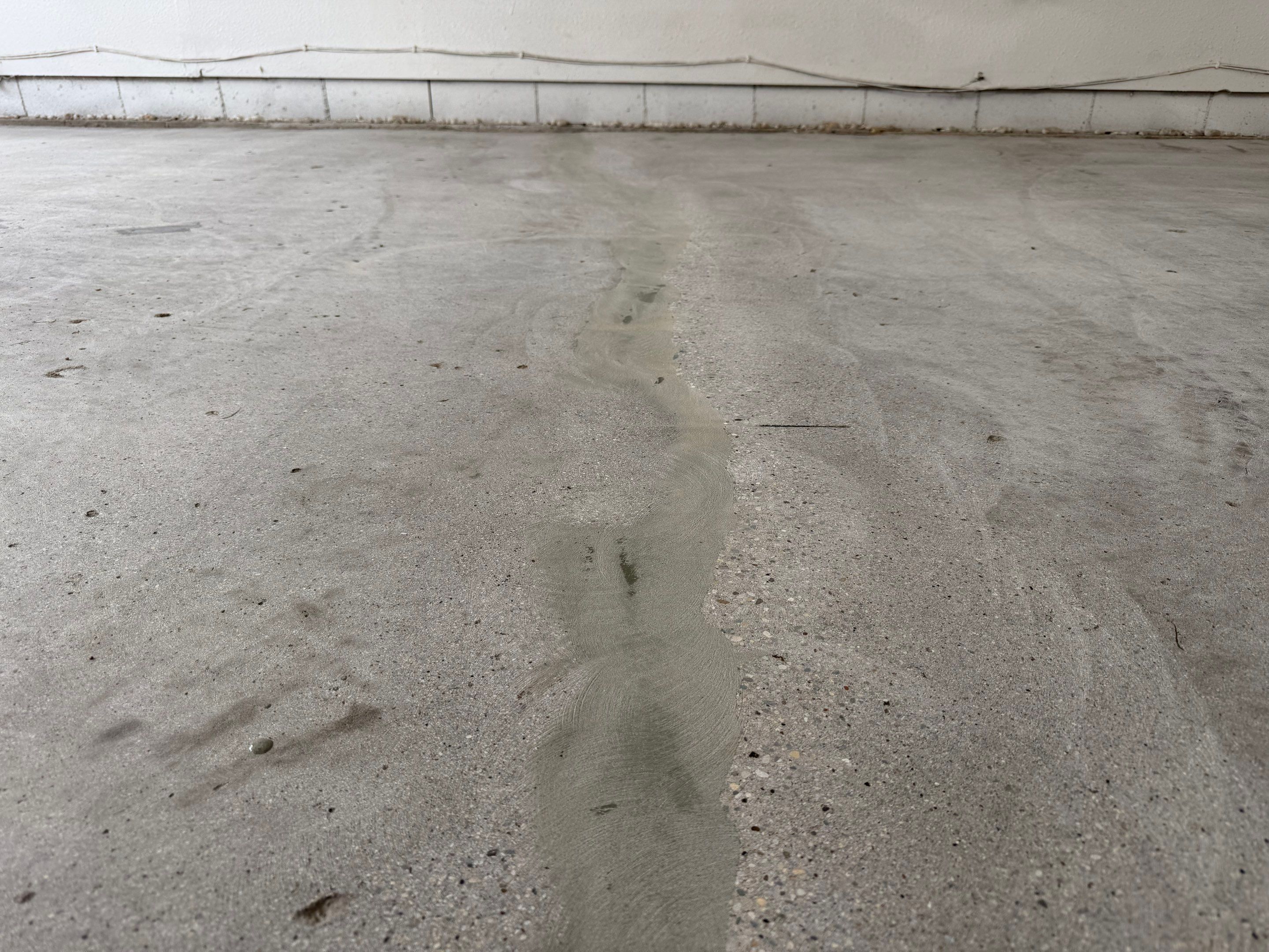 Feather Grey Garage Floor Coating and Crack Repair in Beresford by Select Painting, Coatings & Garage Cabinets