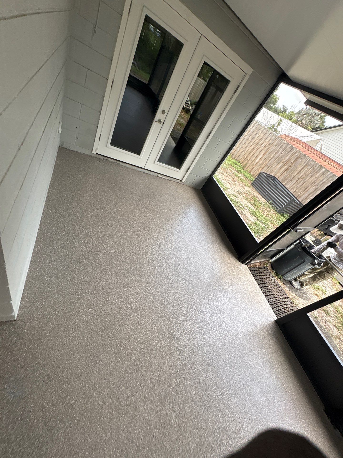 Screened-in Lanai Polyaspartic Floor Coating Installation in Riverview by Performance Floors & Coating