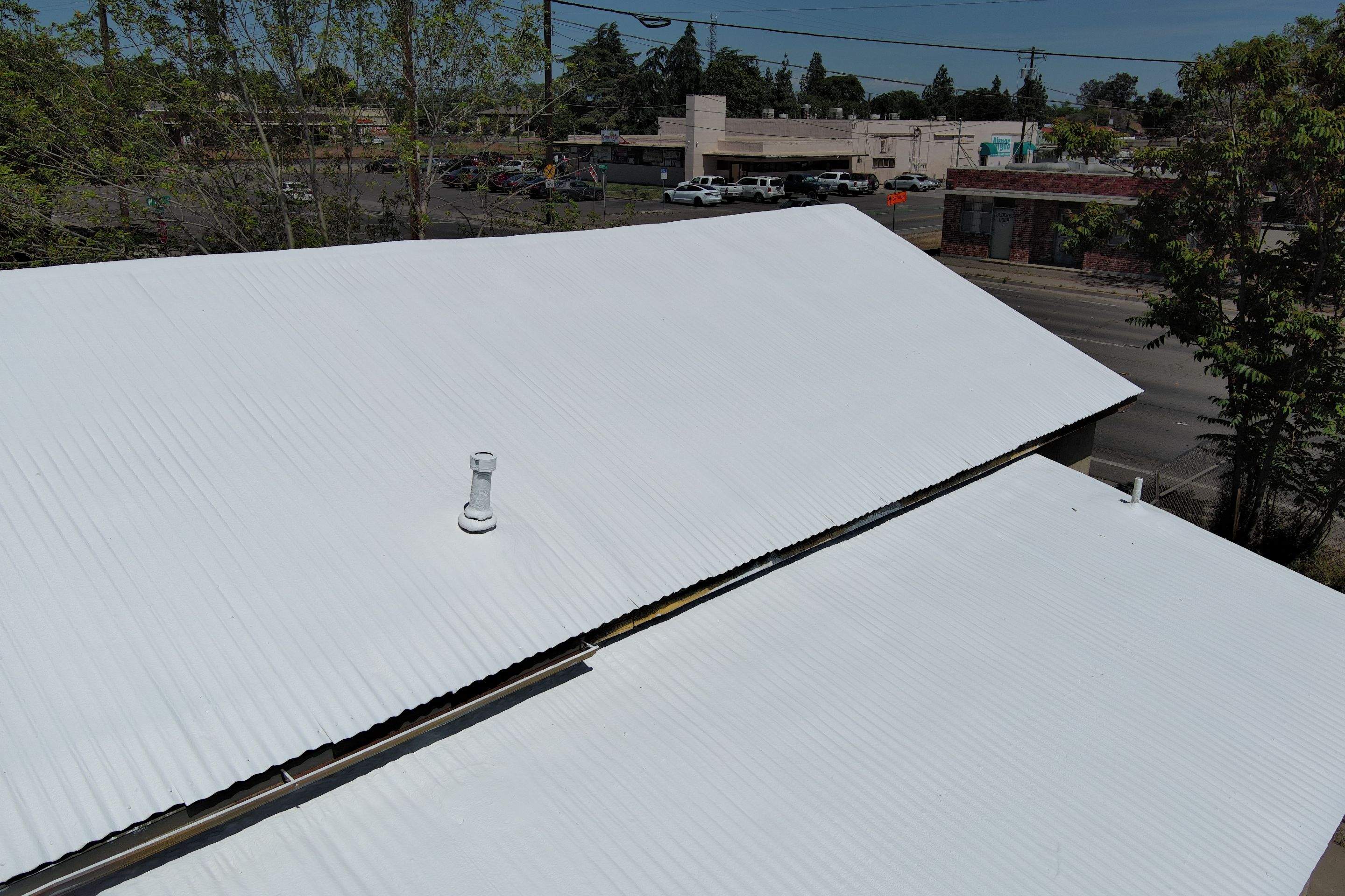 Spray foam and coatings using Conklin Benchmark/PUMA XL by Straight Edge Roofing Inc