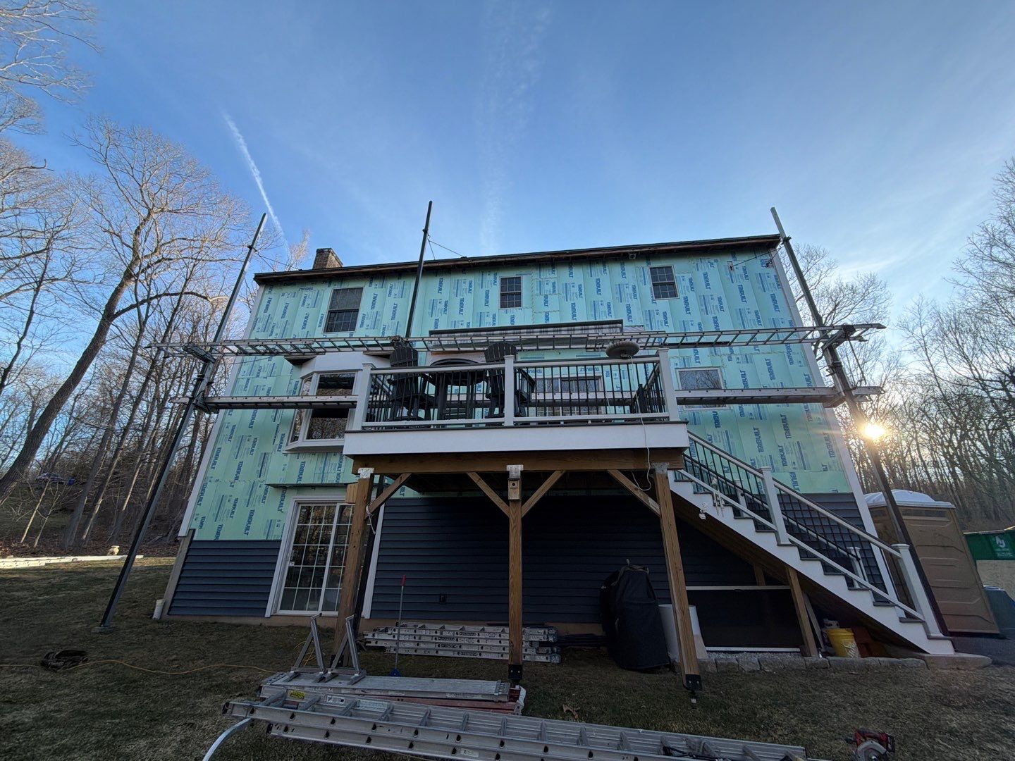 Renewed Siding with Cert. Cedar Board & Batten S-8 Deep Mineral, and Cert. Monogran D/5 x 12'6" clapboard Deep Mineral by DiGiorgi Roofing and Siding Inc