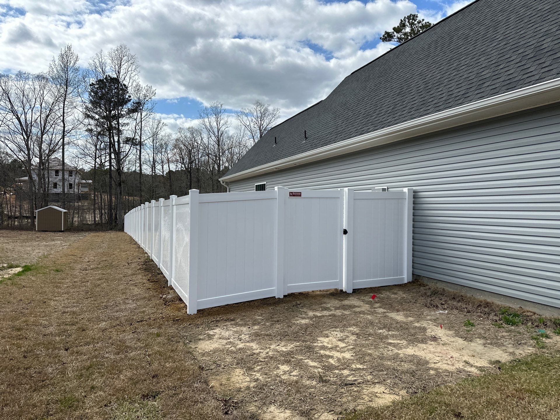 White Vinyl Privacy Fence Installation in Cameron, NC by Superior Fence and Rail