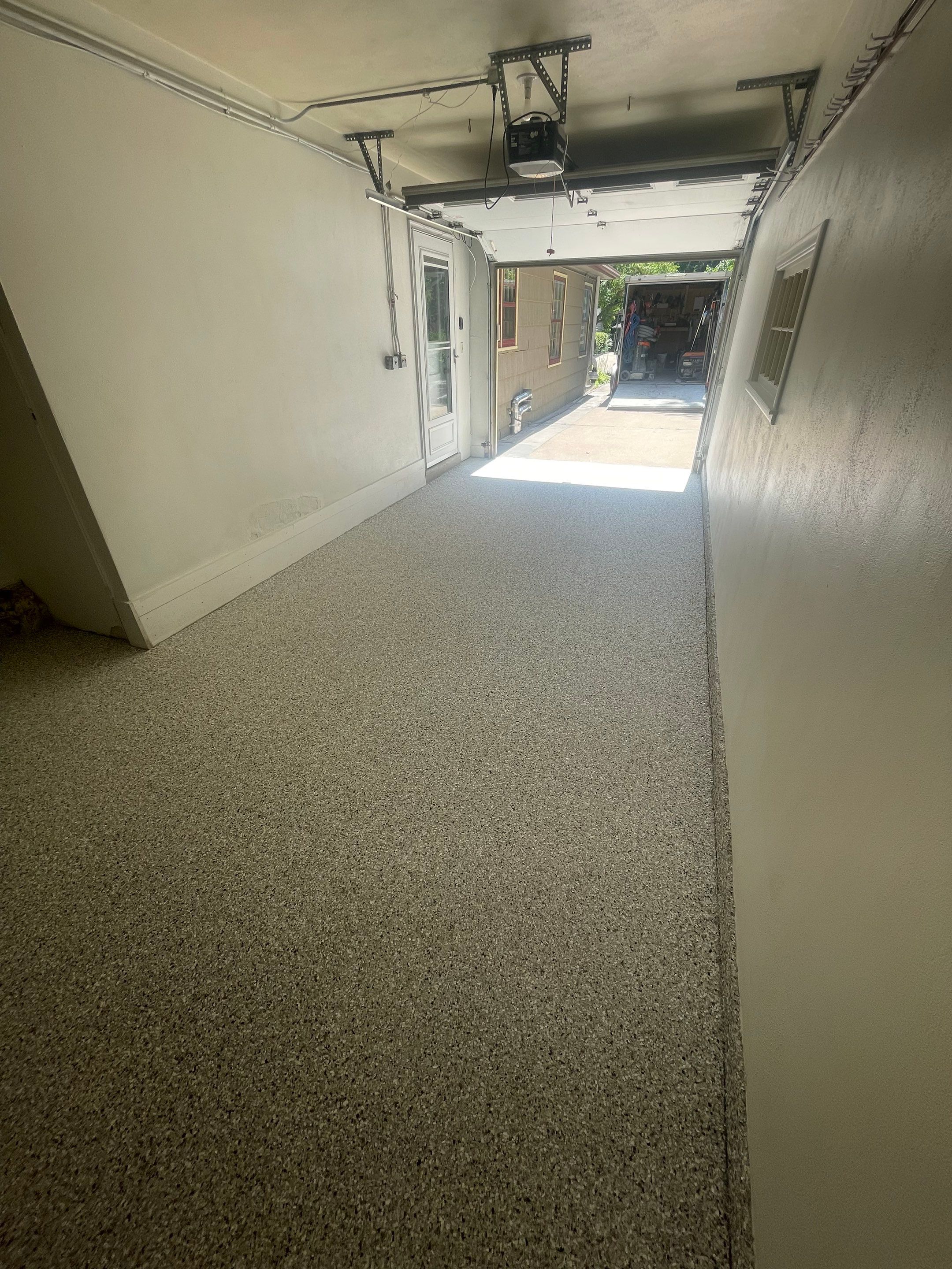 Sioux Falls Garage and Sunroom Concrete Coating with Coyote Flake by Select Painting, Coatings & Garage Cabinets