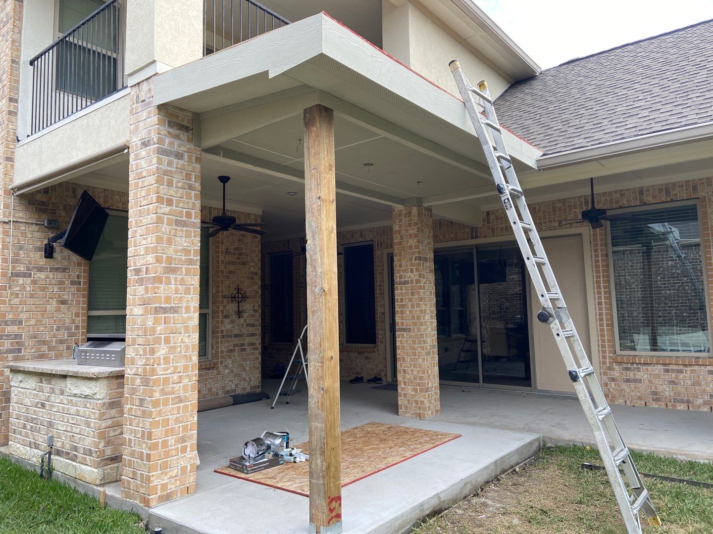 Patio Extension for Outdoor Kitchen by Houston Roofing & Construction