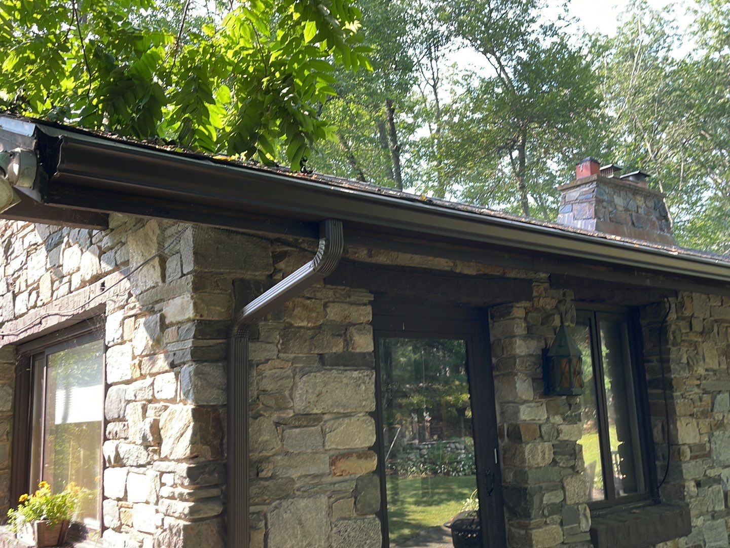 Gutter Installation using 5k Brown Gutters by A Plus Exterior
