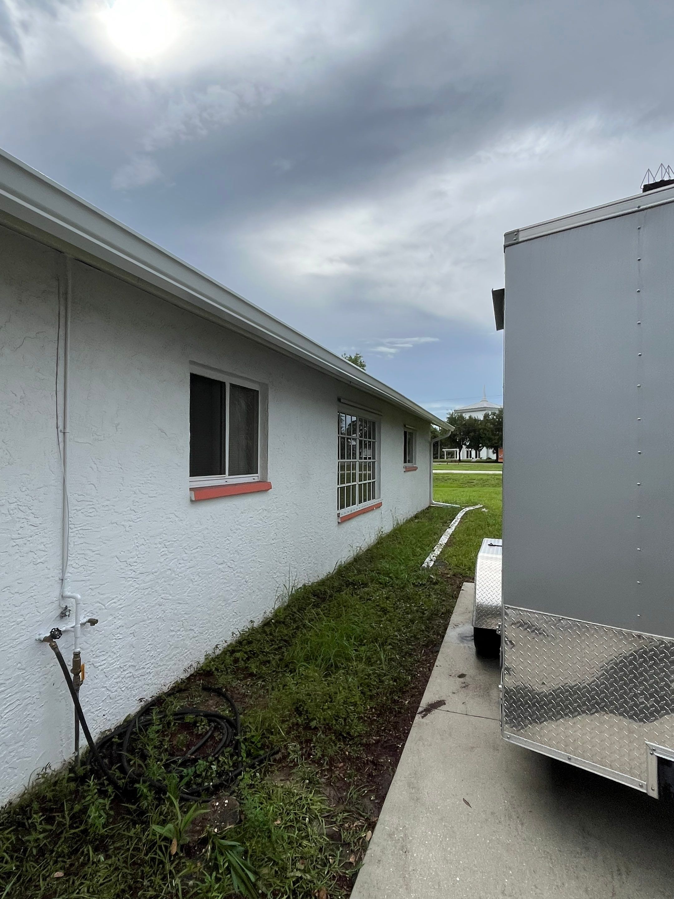 White Seamless Gutters with Splash Guards in North Fort Myers FL by Gutter Professor   by Gutter Professors