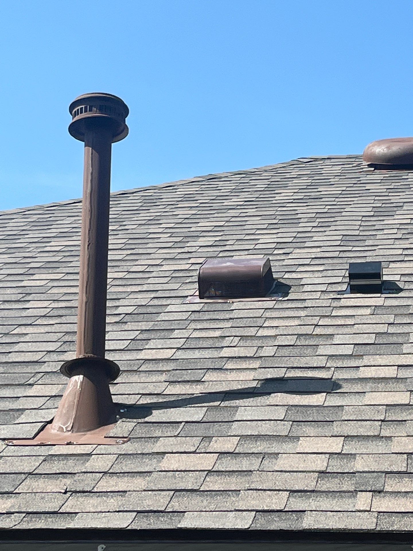 Medium brown brick with IKO Driftshake by Tejas Roofworks + Restoration