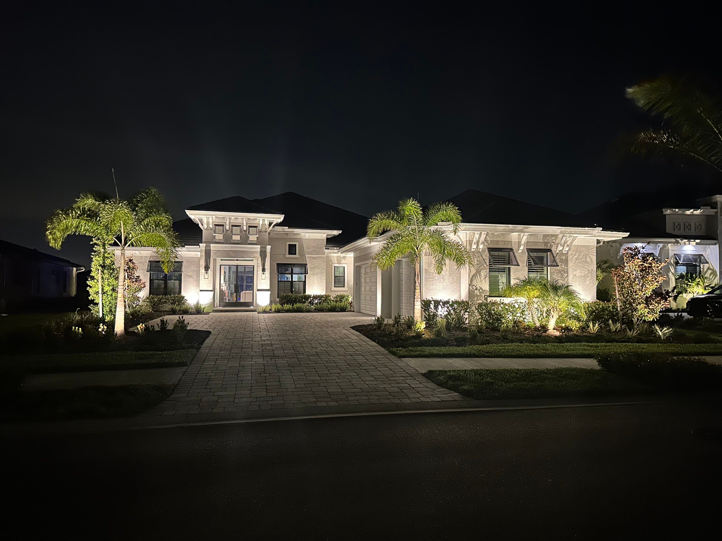 Architectural and Landscape Lighting Installation for Modern Sarasota Home by Illuminate Landscape Designs