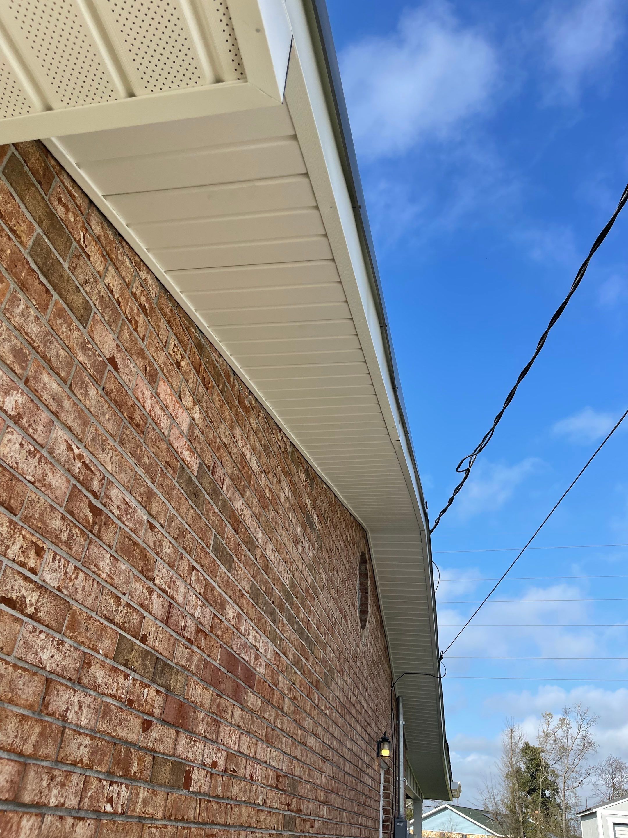 Soffit and Fascia Installation Using White Vinyl Soffit by Gutter Professors