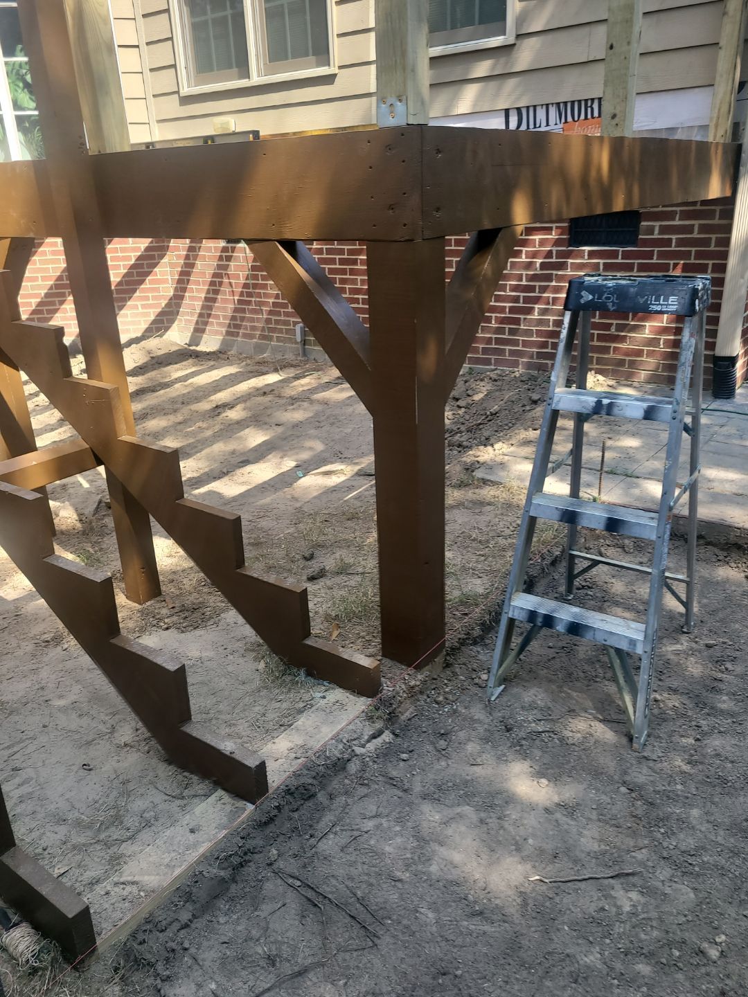 Fuquay-Varina Outdoor Upgrade – Composite Deck & Paved Landing by Elite Remodeling and Design LLC