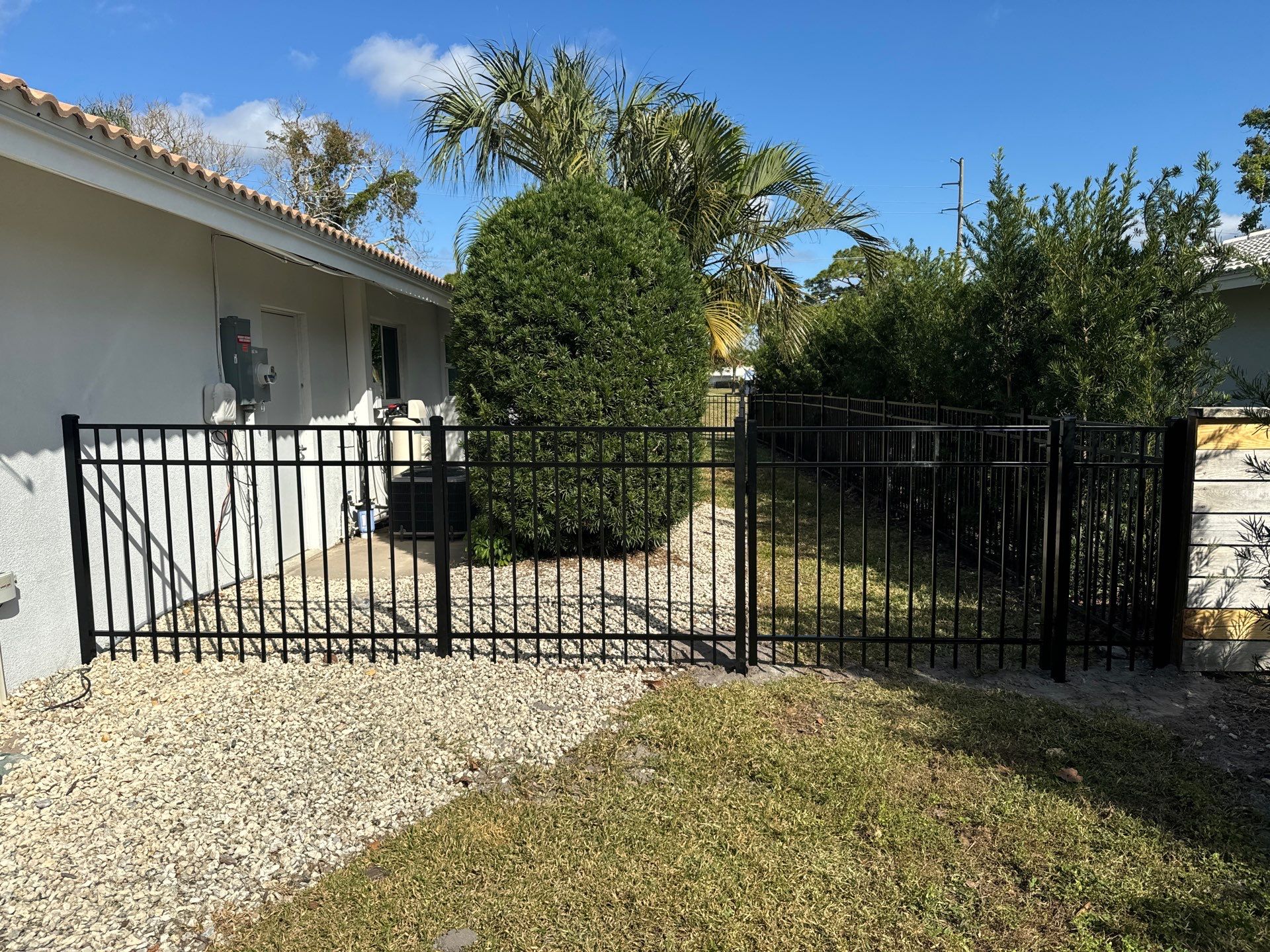 Aluminum Fence Installation using 3 Rail 4Ft Black Aluminum and 4Ft White Vinyl Fence by Asap fence and gates, LLC