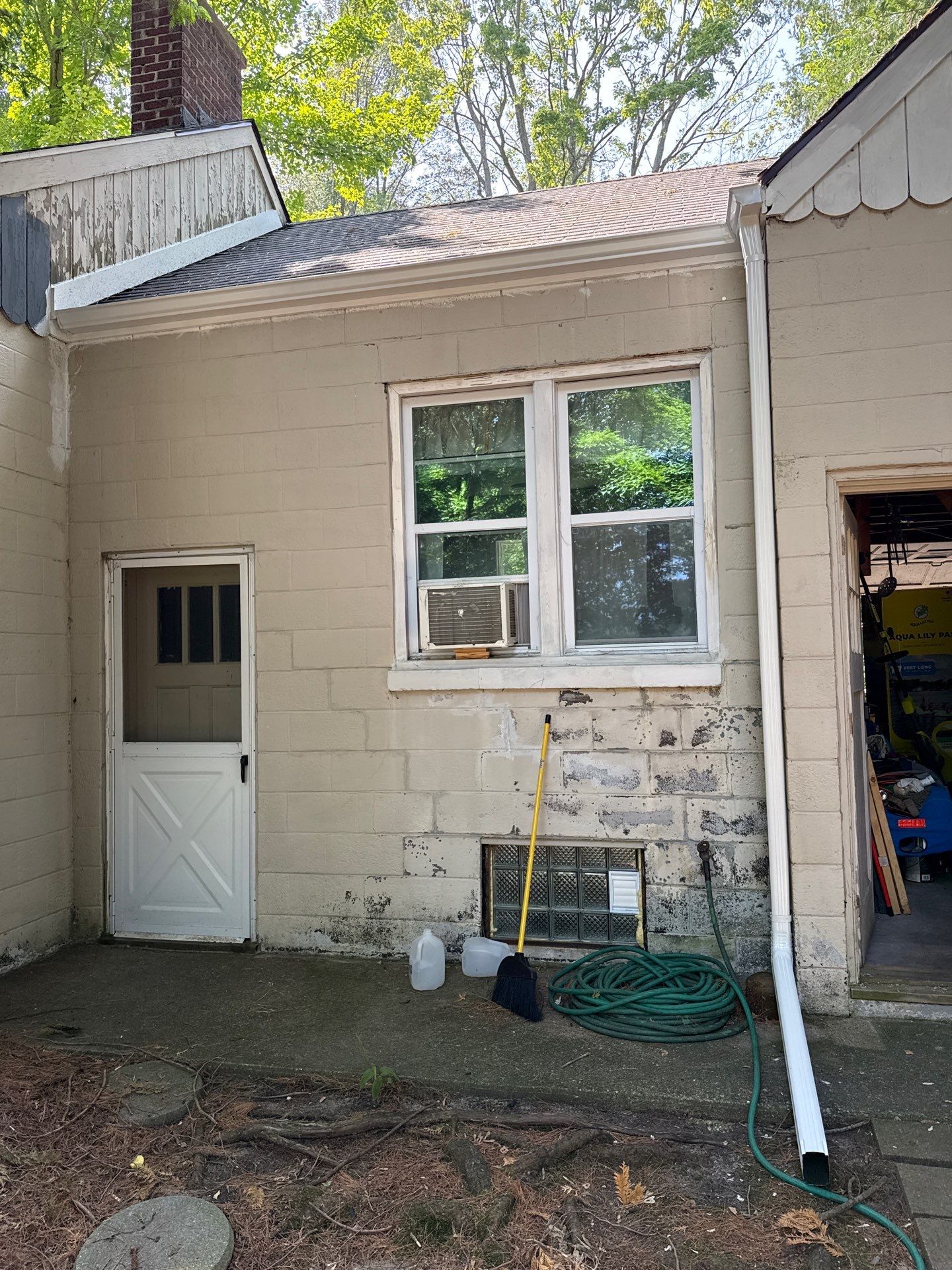 White Metal Gutter and Downspout Installation in Bellaire by Rainbow Seamless Systems