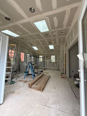 Sun room using Concrete wood lumber, insulation , drywall, painting , cabinets , laminate floor .